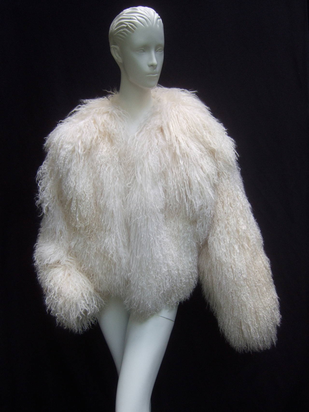 Tibetan fluffy lamb fur chubby jacket for Neiman Marcus c 1980s
The stylish white lamb fur boxy jacket is designed with billowy 
curly lamb fur throughout

The voluminous chubby style fur jacket is designed with 
a set of side pockets and is