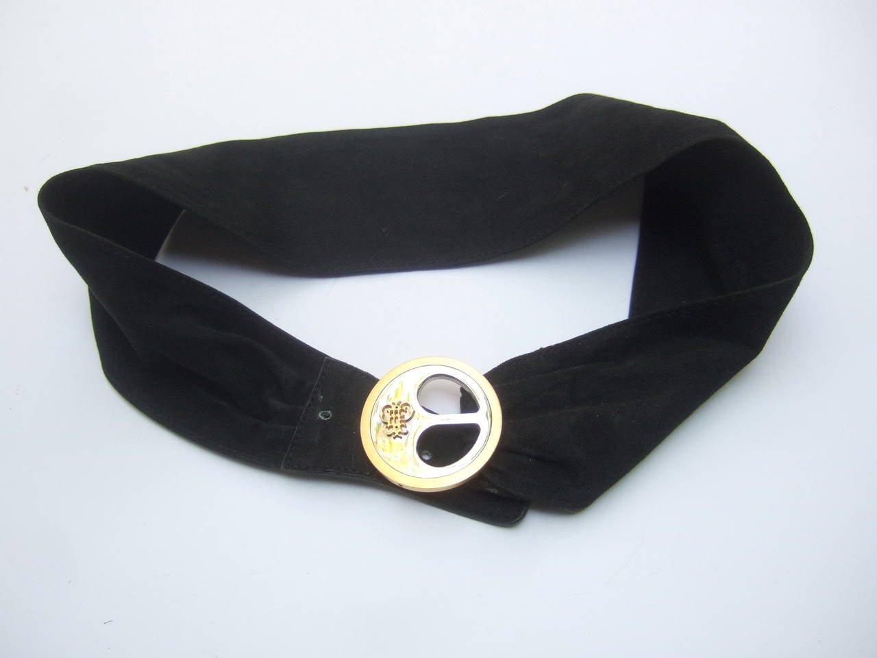 Emilio Pucci Black suede strap belt Made in Italy c 1970s 
The designer Italian belt is adorned with a sleek
chrome and gilt metal circular buckle

The round metal buckle has a gilt metal medallion
The belt is designed with a wide supple black