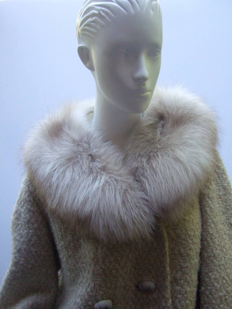 Plush fox trim double breasted boucle wool knit jacket c 1960
The chic retro jacket is designed with chunky cream & beige knit
The fluffy fox fur collar & cuffs add a dash of elegance 

The boxy wool knit jacket is designed with six large
resin