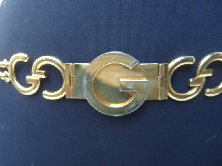 Gucci Sleek gilt metal hinged link belt Made in Italy c 1970
The chic retro belt is designed with Gucci's interlocked 
gilt metal interlocked initials. Interspersed throughout 
the design are Gucci's signature horse bit hinged links 

The high