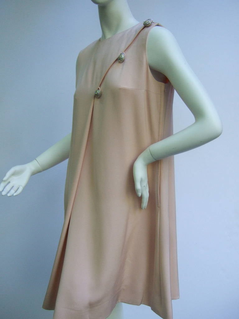 BILL BLASS Blush pink silk sleeveless sheath dress c 1970
The elegant dress is designed with luxurious pale pink silk
The chic dress drapes beautifully with the lavish silk fabric
The understated dress is designed with an inverted pleat 
on both