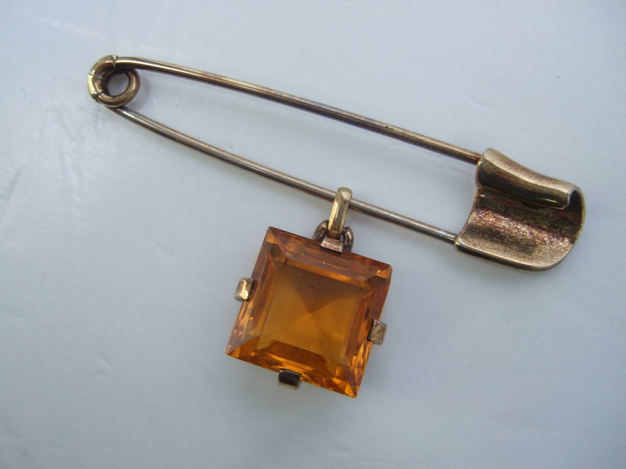 large gold safety pin brooch