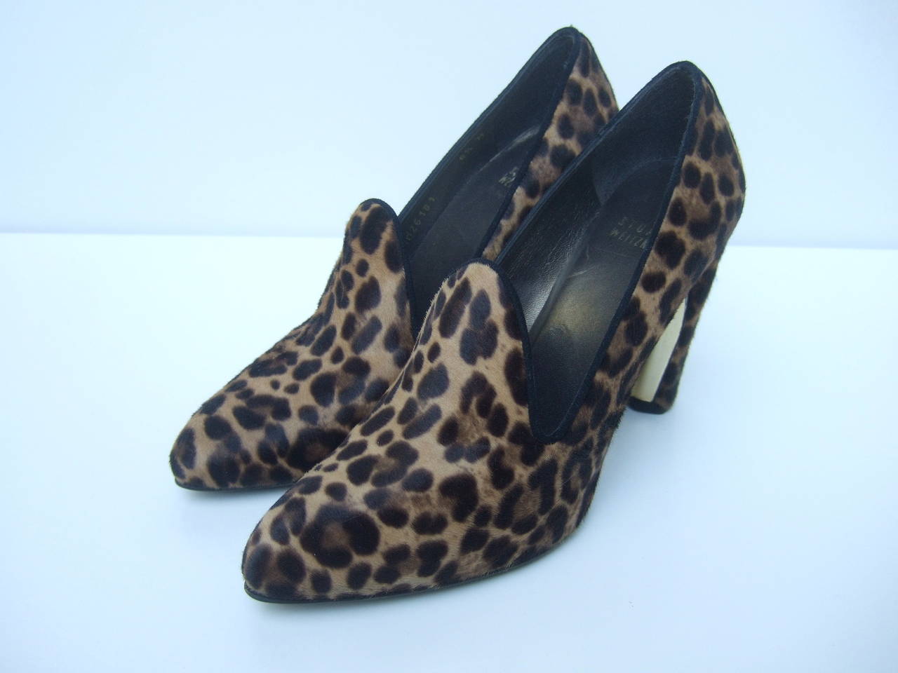 Stuart Weitzman Exotic pony fur pumps US Size 6.5 Medium
The stylish designer shoes are covered with animal print pony fur
The heel is accented with a gilt metal plate on the interior underneath 
side

The high fashion shoes make a very