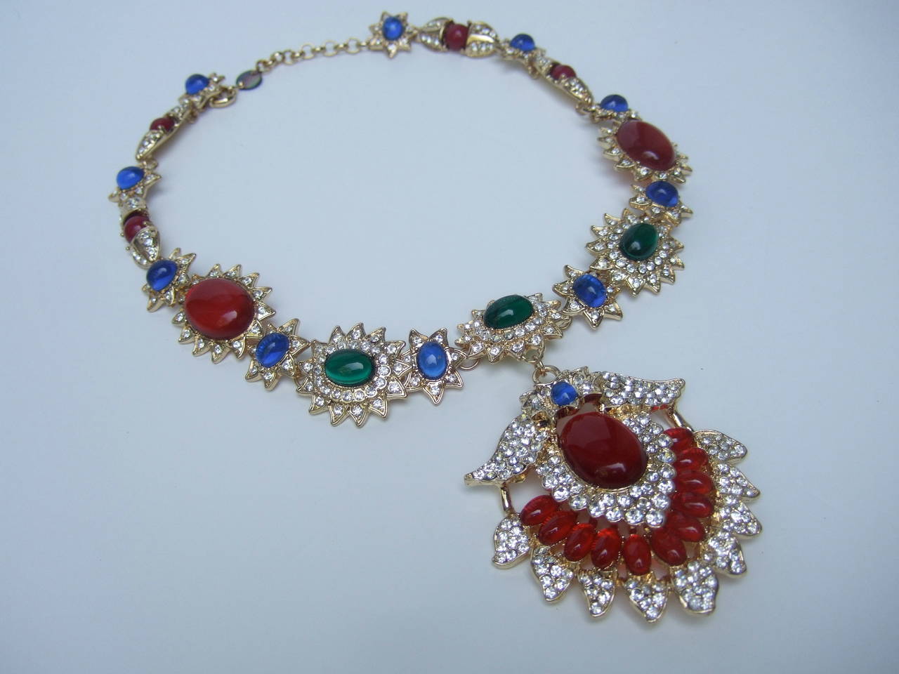 Stunning opulent jeweled cabochon & crystal necklace 
The lavish necklace is encrusted with glittering jewel tone lucite cabochons
& diamante crystals. The beautiful combination of faux resin rubies, sapphires 
& emerald green lucite cabochons