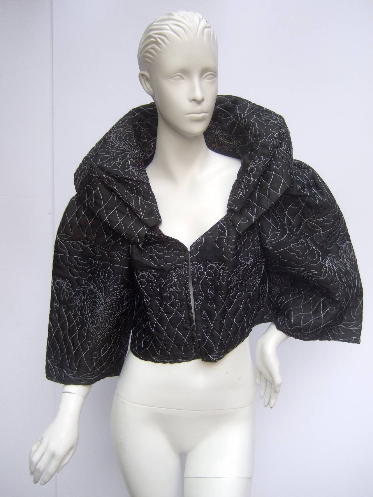 ***RESERVED SALE PENDING FOR IAN HYLTON***
Christian Lacroix Black embroidered quilted cropped bolero
The stylish high fashion jacked is embellished with intricate floral designs 
with subtle hearts. The white embroidery illuminates against the