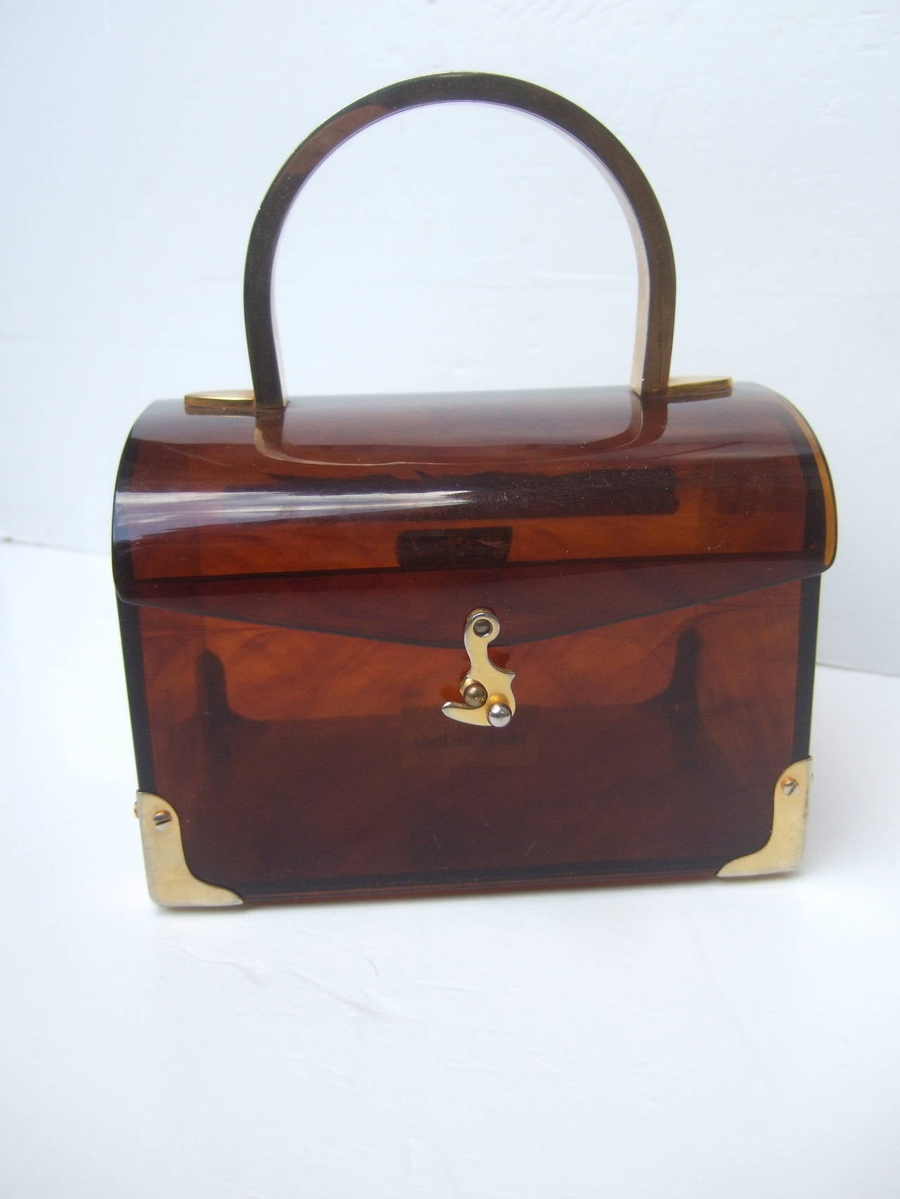 Colbentz Original stylish lucite tortoise shell handbag Made in Italy
The chic box style handbag is accented with a gilt metal handle & hardware
The posh Italian handbag makes an unique accessory

Labeled: Colbentz Original Made in Italy