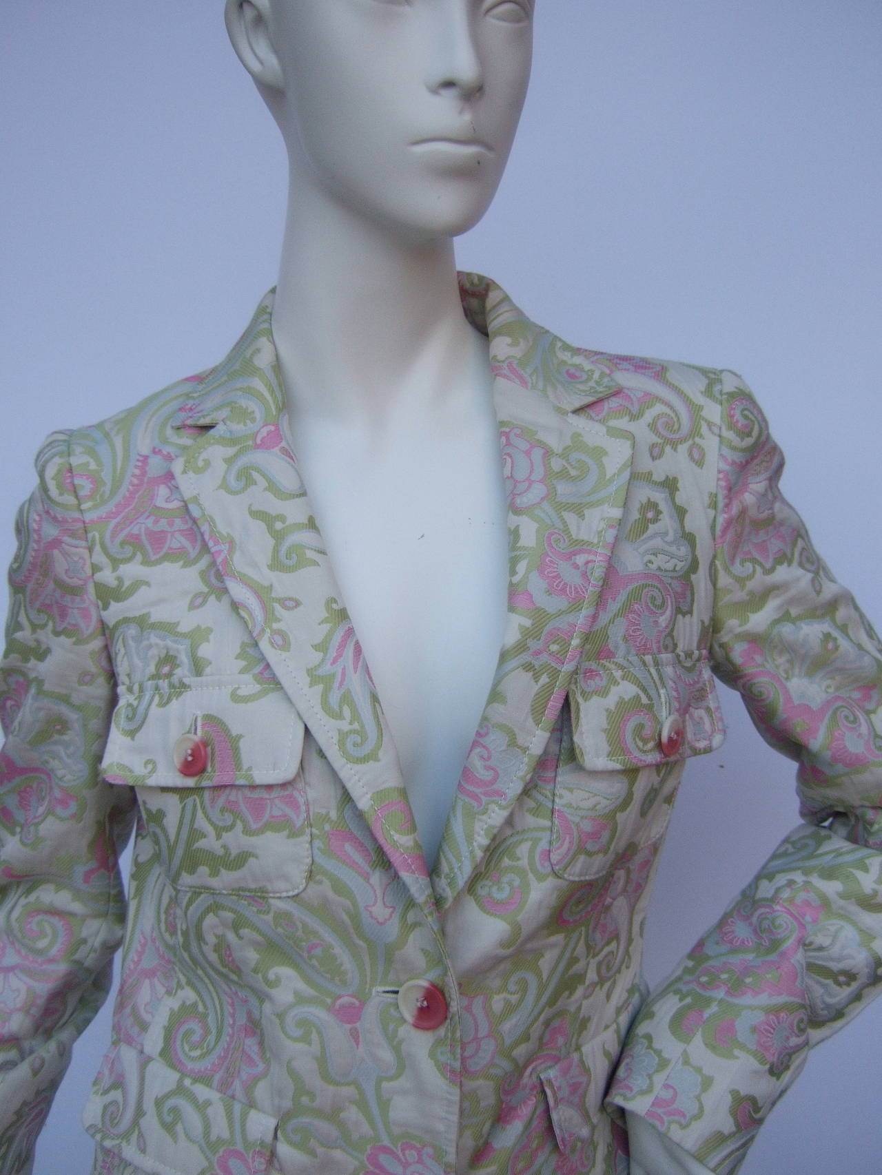 Etro Milano Paisley floral pink & green brocade coat  Made in Italy Size 40
The Italian designer coat is designed with mauve pink & chartreuse green paisley floral designs 

The stylish coat closes with pink & white resin buttons stamped Etro