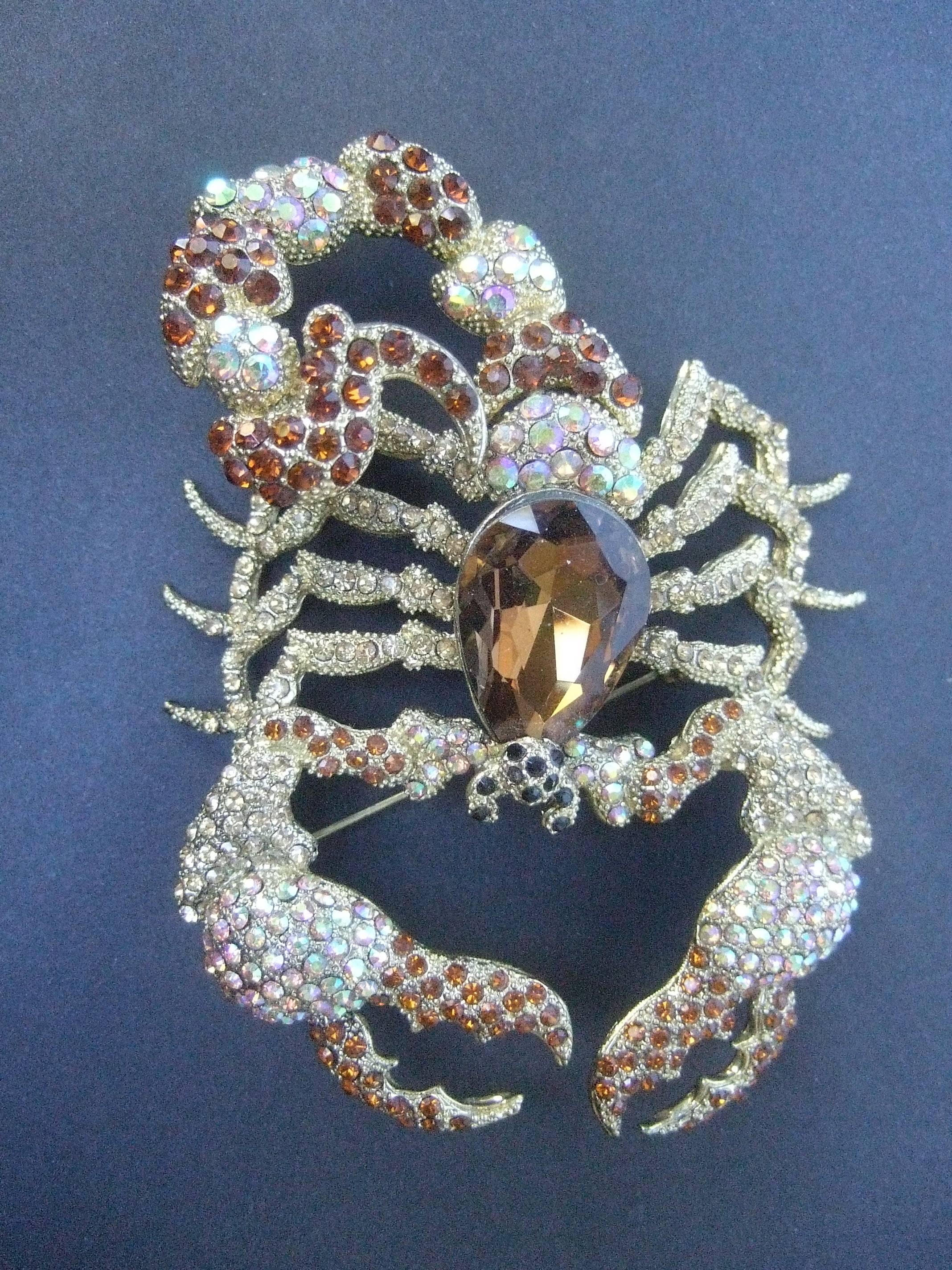 Massive glittering crystal scorpion brooch
The large scale scorpion is encrusted 
with brilliant crystals in smoky brown
topaz accented with auroraborealis crystals

The threatening pincers and tail appear 
ready to strike!

Makes a very