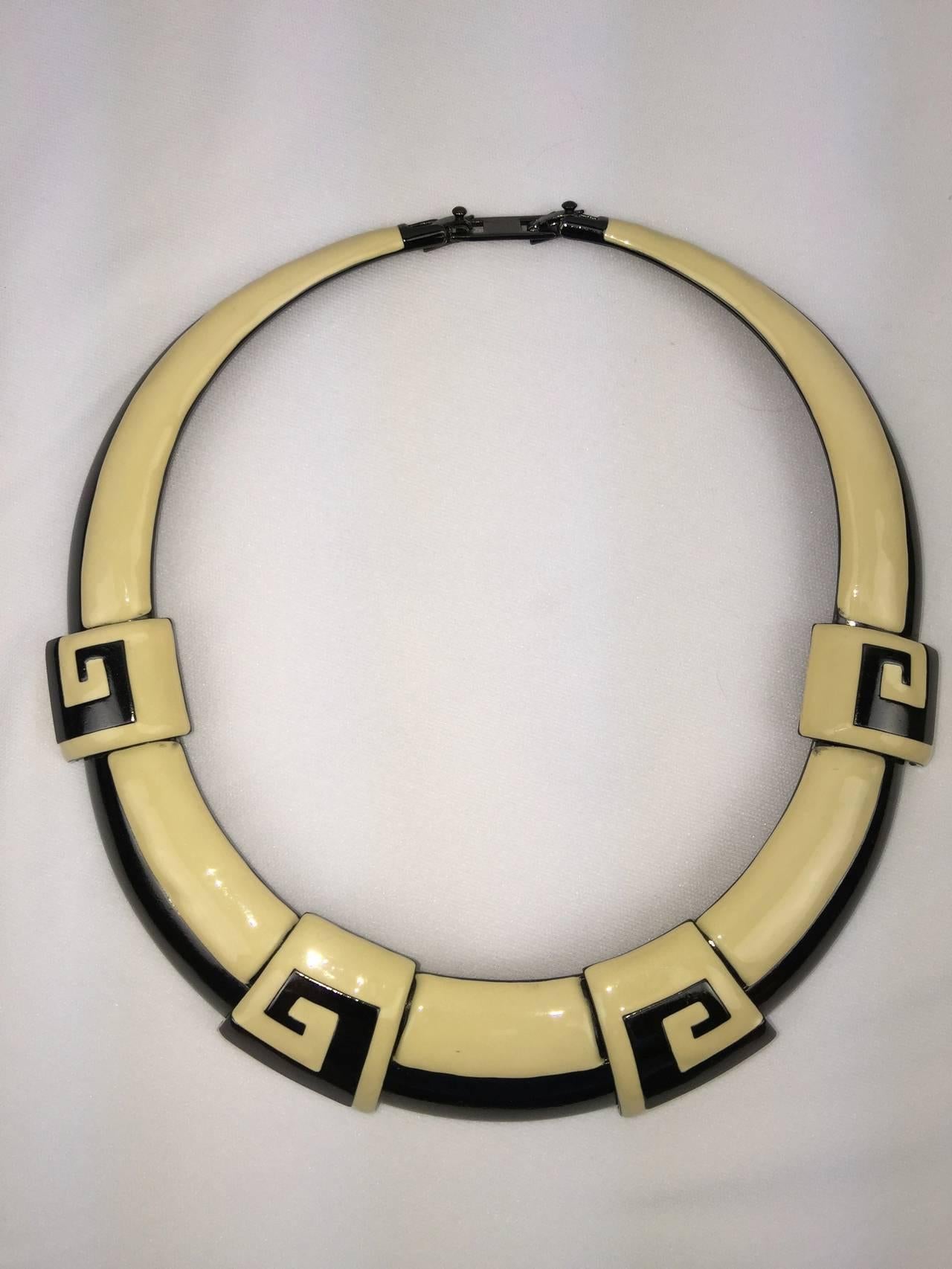 
This bold and graphic Monet set is designed for maximum but elegant impact.

Big chunky necklace and earring set in cream and black enamel.

Greek Key design.  Such clean lines.

The necklace is constructed of articulated enameled metal