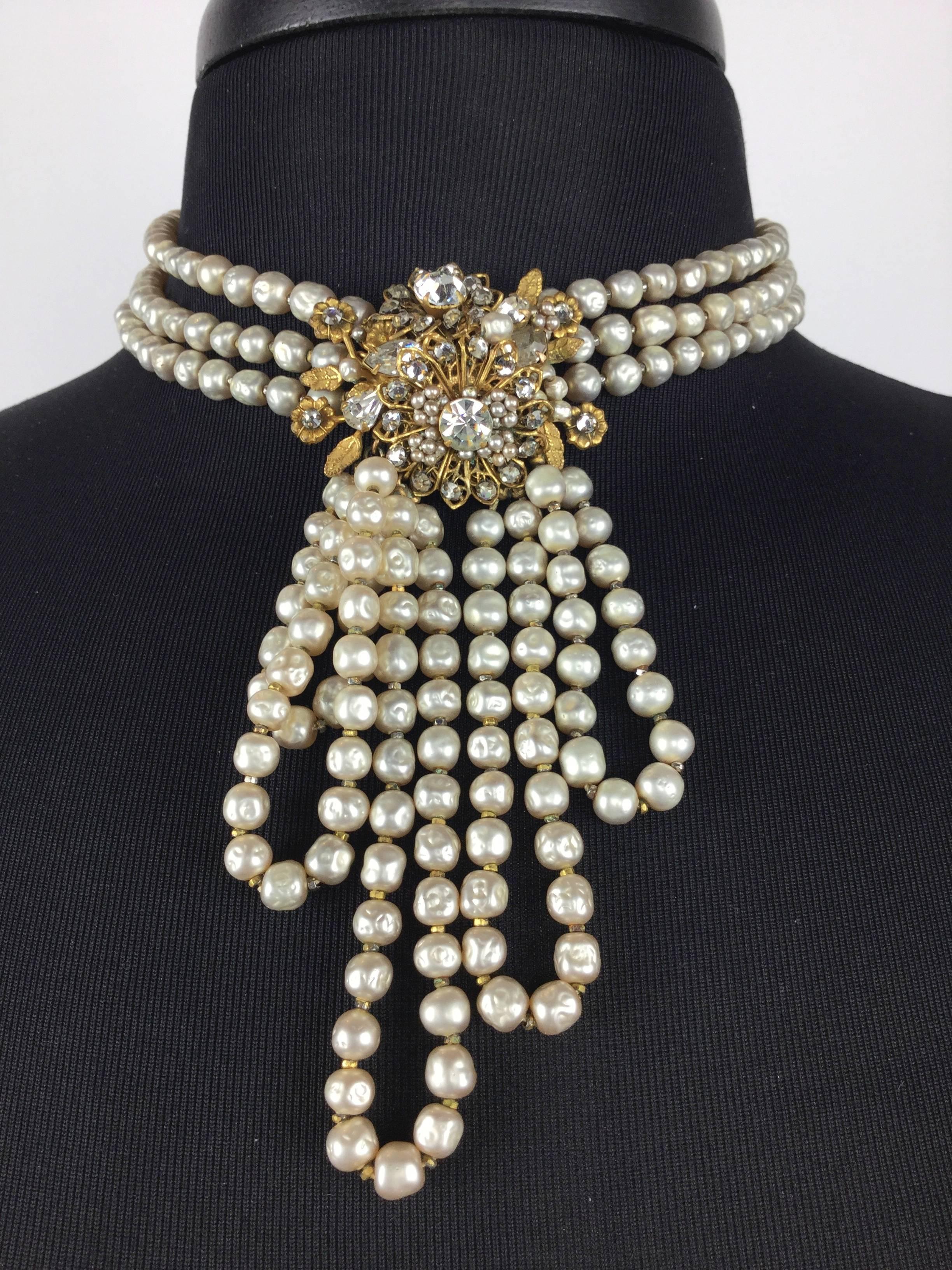 
This piece is simply stunning!  

Edwardian style faux pearl necklace with paste encrusted floral 
centerpiece.

Demario worked with the same baroque faux pearls, foiled pastes,
and honey colored Russian antique metal work so beloved by