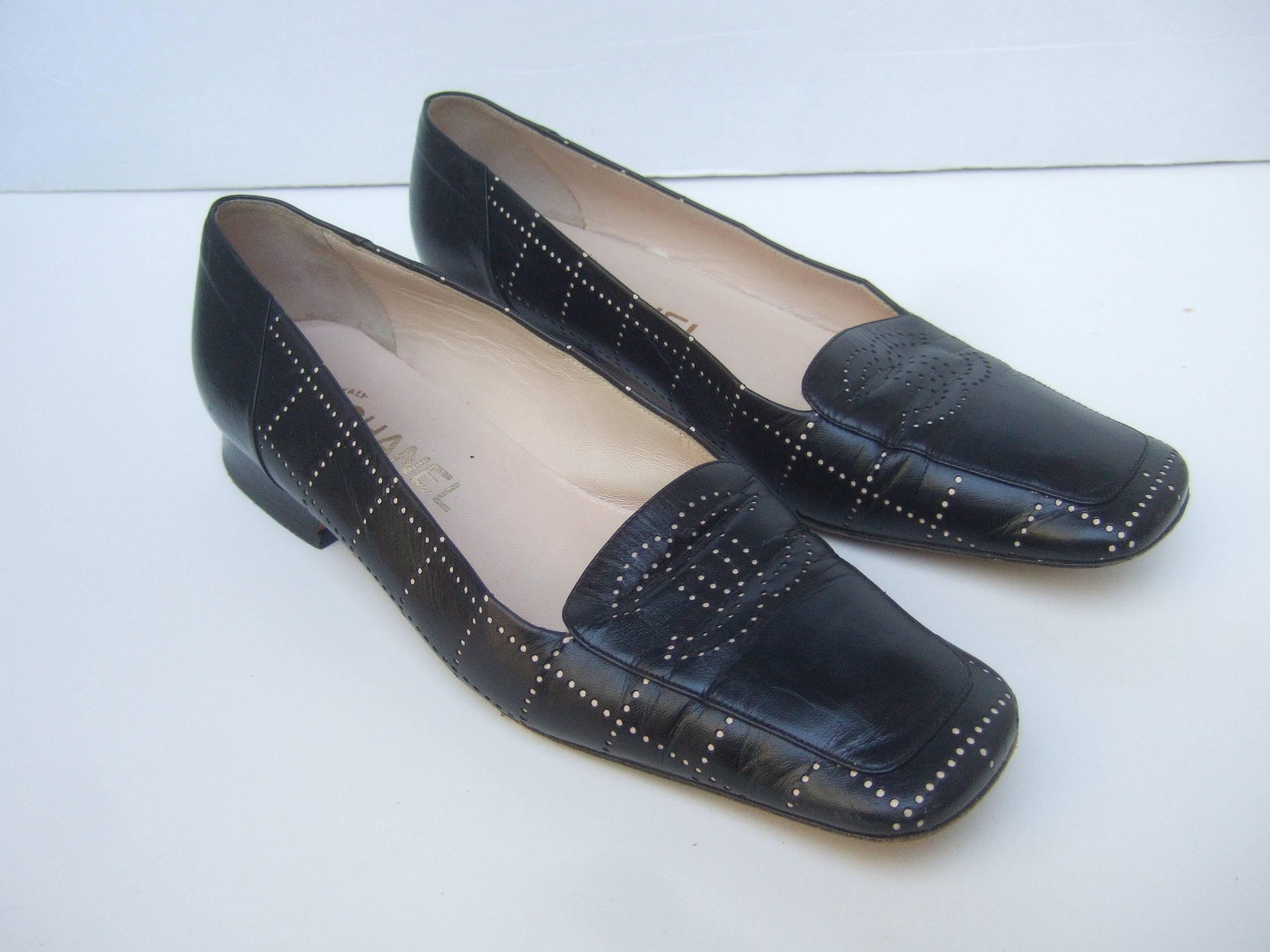 Chanel Stylish black leather perforated skimmer flats Size 37.5 
The classic black leather loafers are covered with black
leather with Chanel's large interlocked C.C. initials 
on the front

The shoes have subtle perforated detail for the
