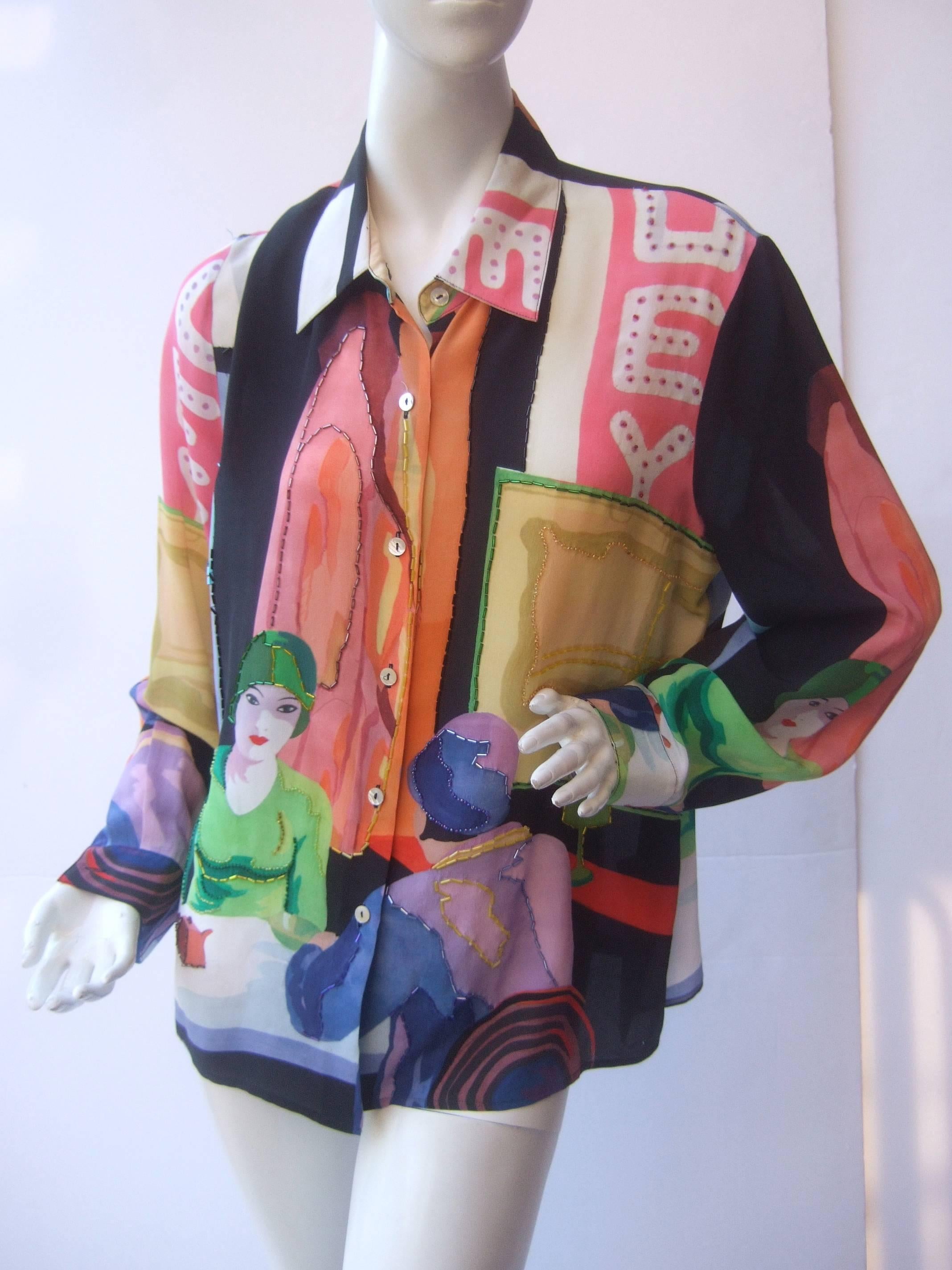 ***RESERVED SALE PENDING FOR DANIEL***
Silk beaded graphic print blouse c 1990s
The unique high fashion blouse is illustrated 
with a pair of elegant retro style women
having tea 

The bold graphics are a myriad of pastel
colors juxtaposed with