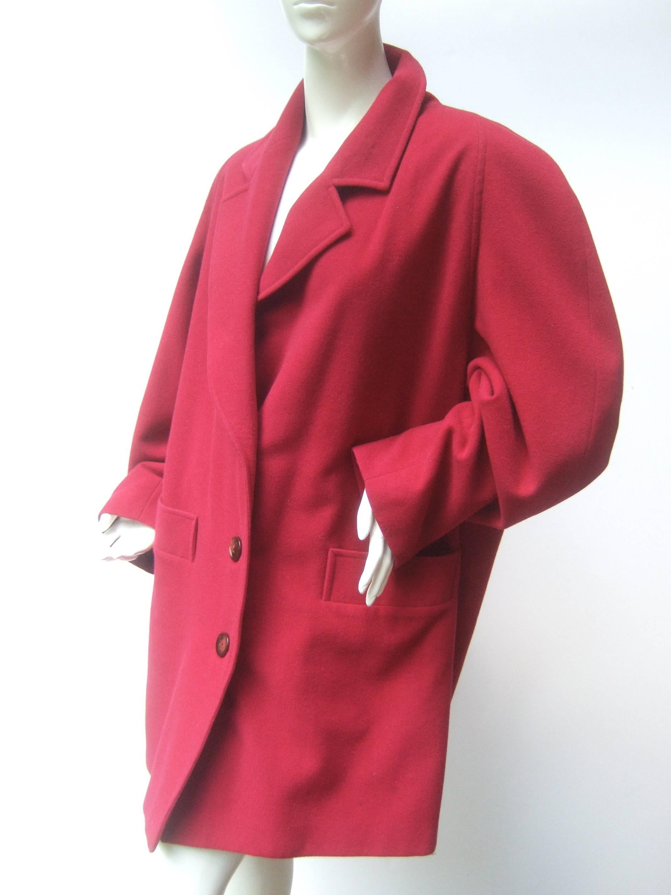 Missoni Donna Berry color wool 3/4 length Coat
The Italian wool 3/4 length coat is designed
with a plush wool shell

Secures with three dark red resin buttons
Both front sides have deep patch pockets 
The boxy silhouette creates warmth and