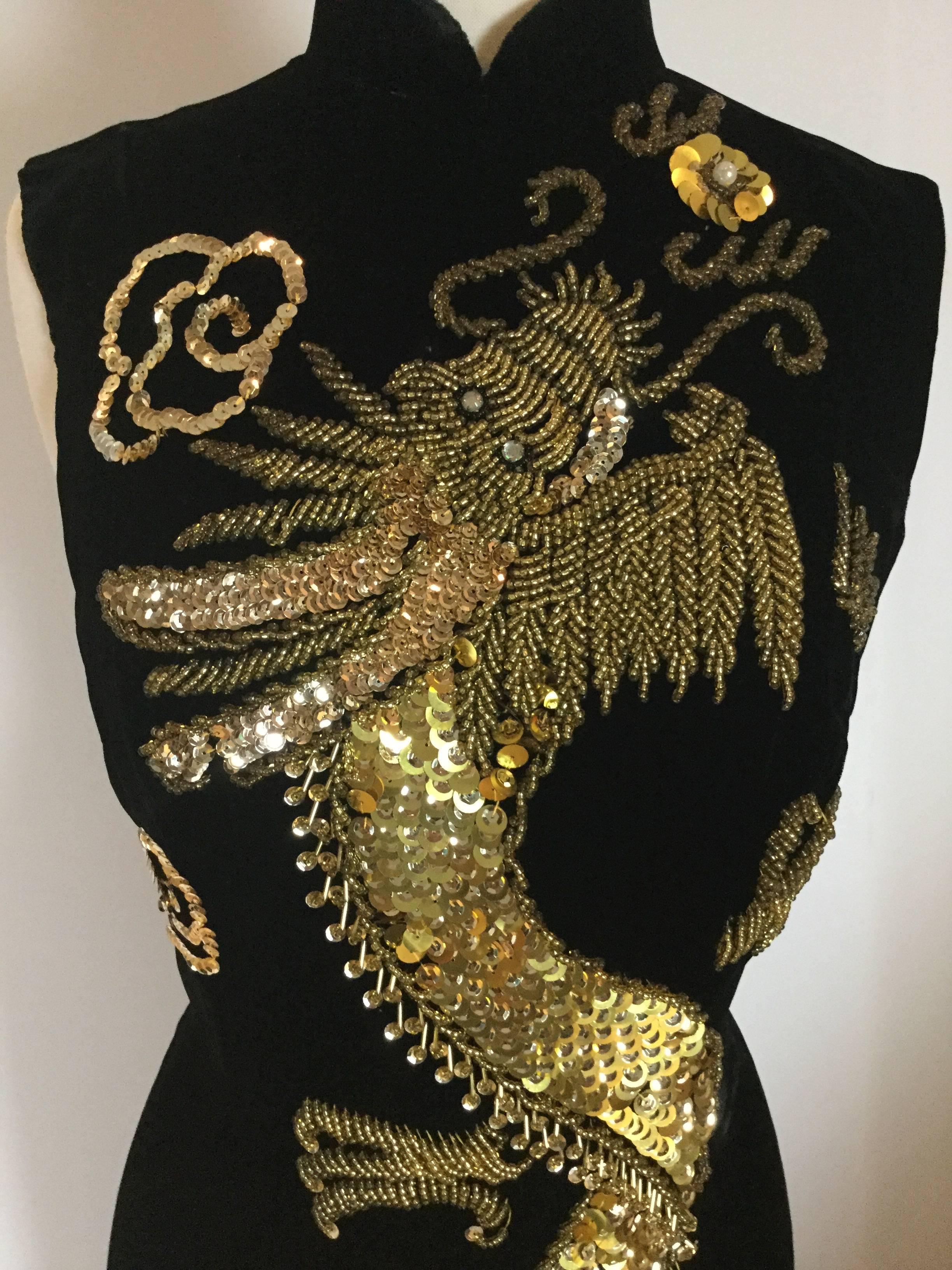 

This is the sort of dress that vintage is all about.

A handmade, one-off, design.

Once it is sold...there will never be another!

Dazzling Cheongsam style sheath dress in black silk velvet
with a simply STUNNING sequin and beaded dragon