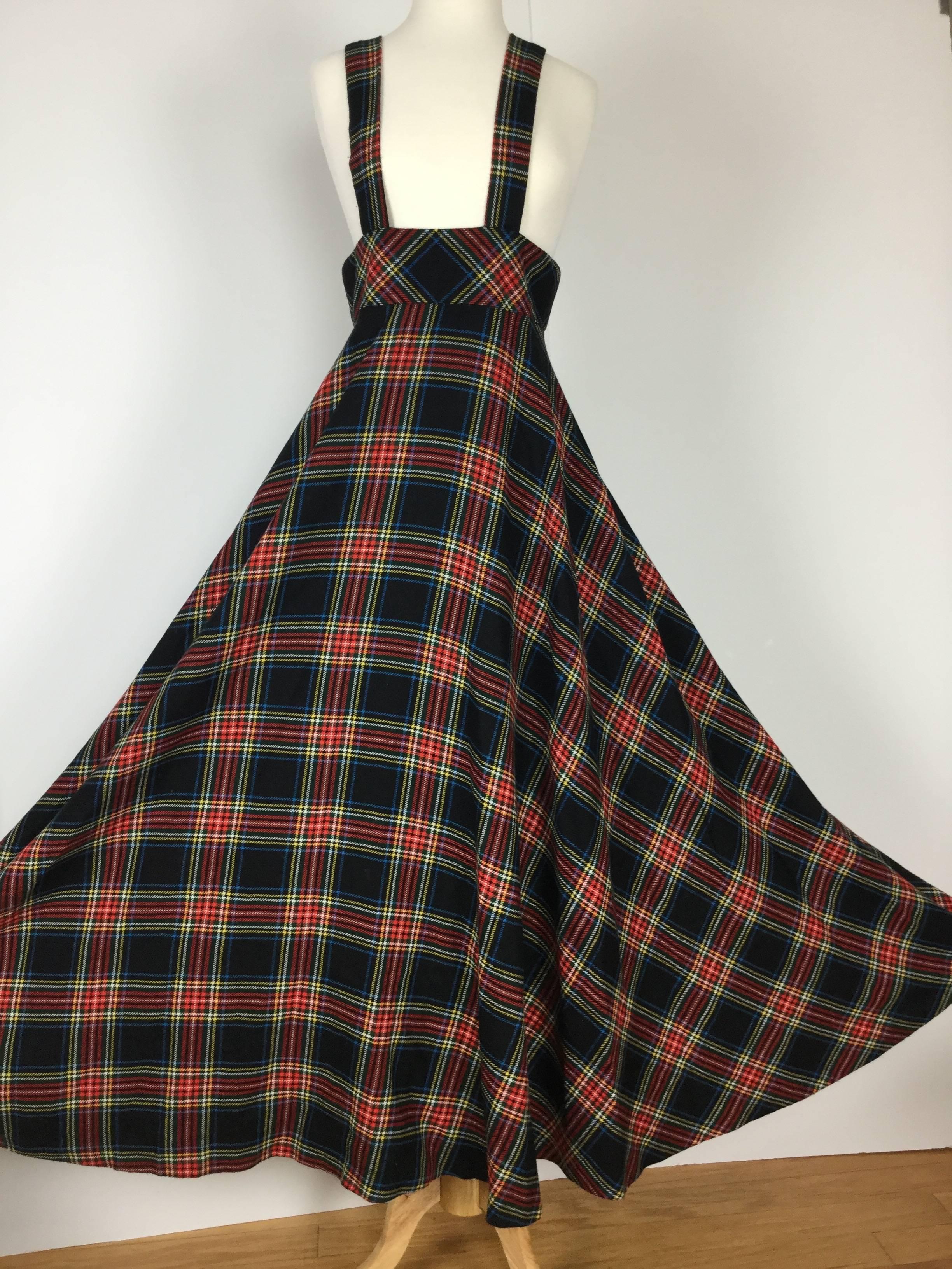 
This is one of the coolest British Boutique pieces I have seen in years.

Tartan wool pinafore with a huge sweeping skirt.

Raised 