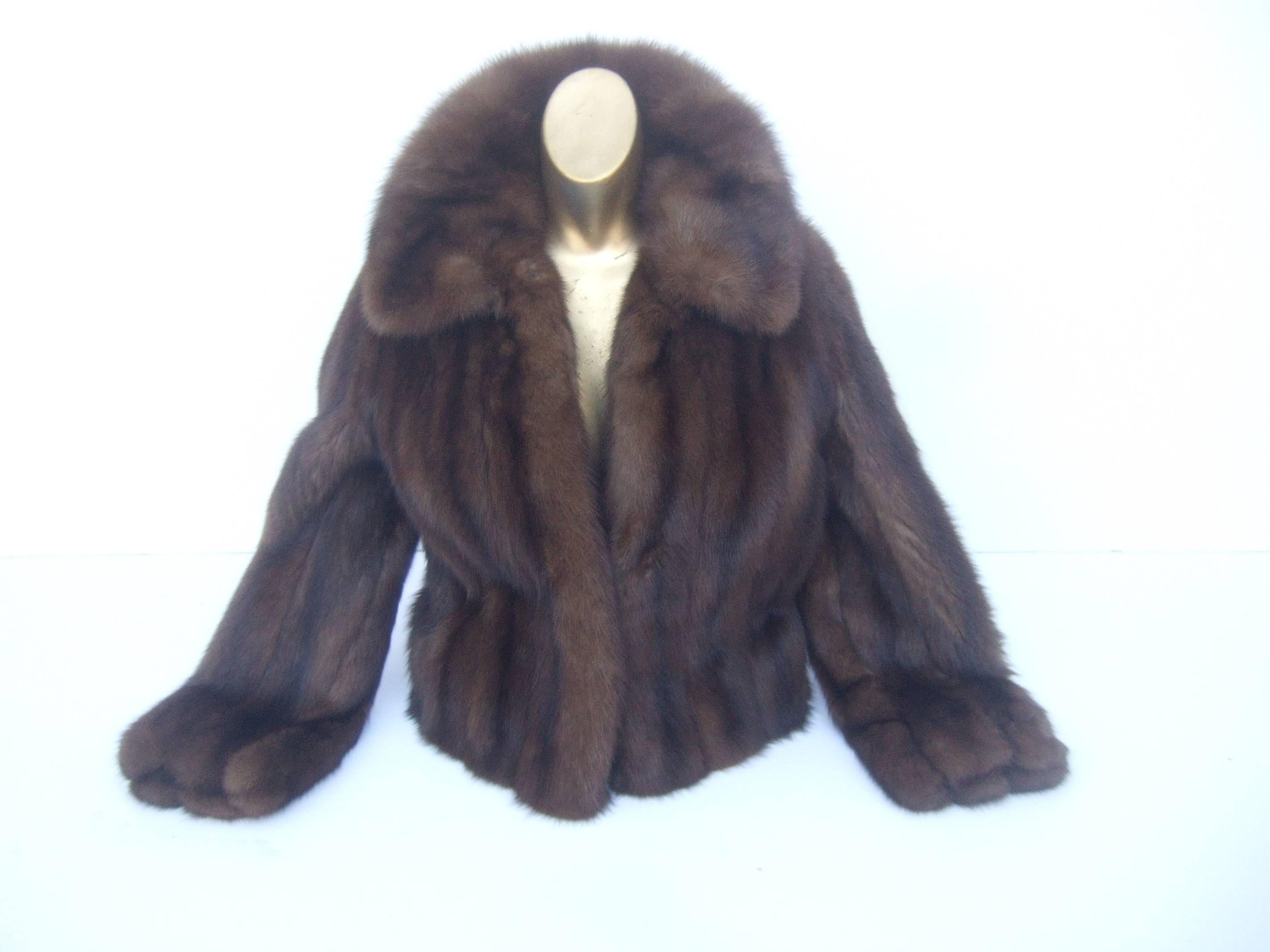 Revillon Paris Luxurious sable fur jacket for Saks Fifth Avenue 
The elegant sable fur jacket is designed with plush 
silky fur. The collar is voluminous and can be folded
up around the neck

The sumptuous sable fur pelts are constructed in a