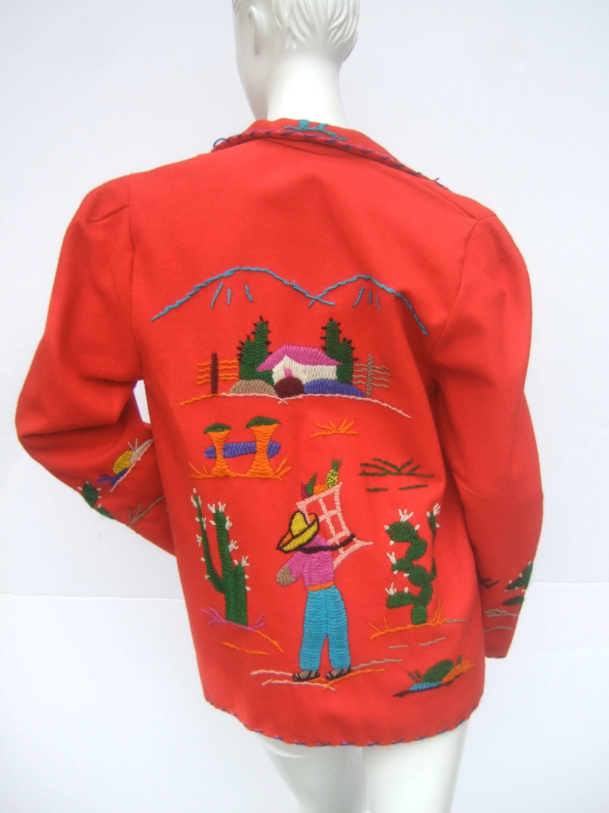 Mexican red felt wool embroidered jacket ca 1950s
The unique vintage wool jacket is accented
with embroidered cactus and designs

The collar and border edges have contrasting
embroidered stitching. The front of the jacket
has a deep patch
