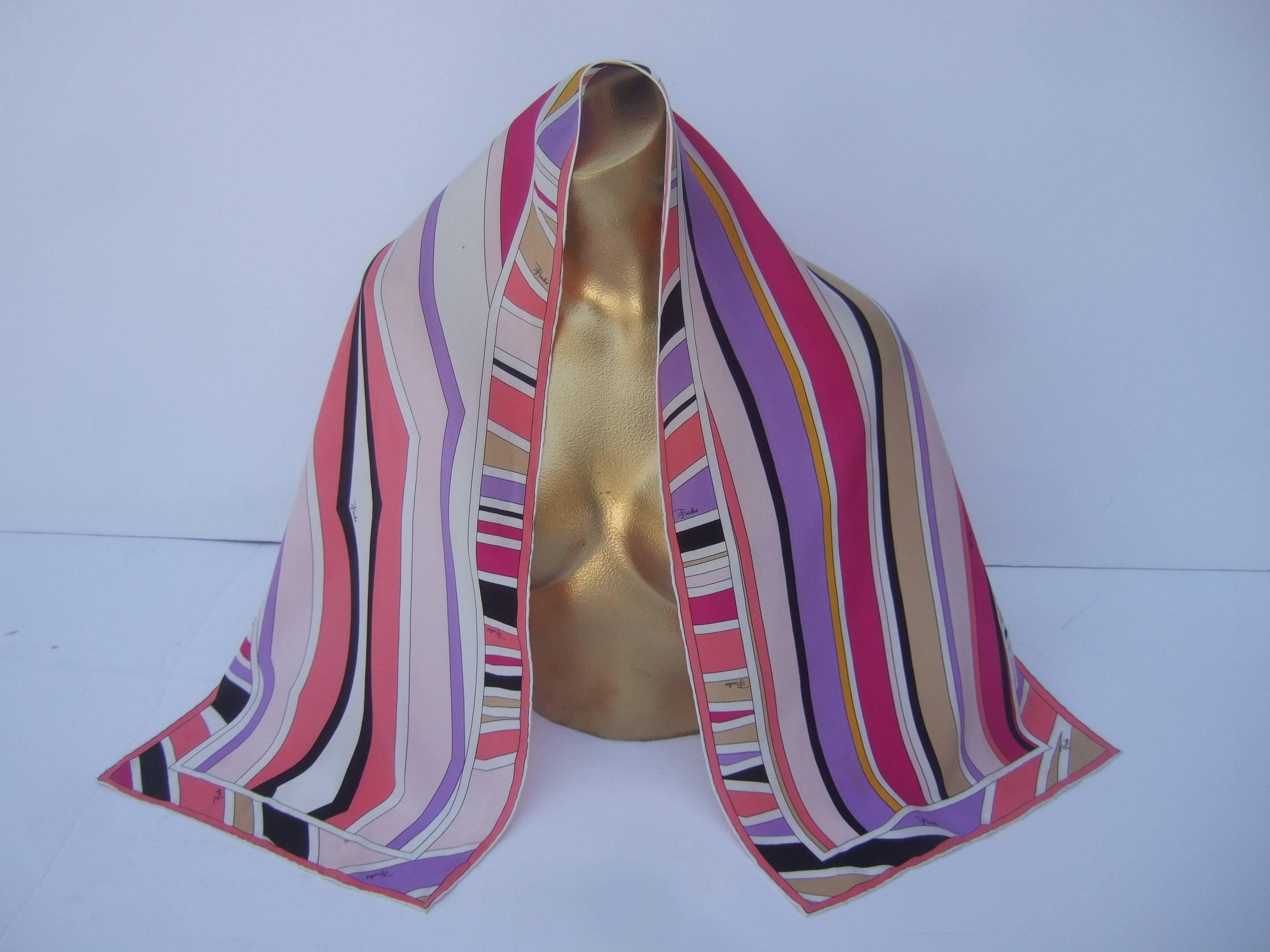 Emilio Pucci Silk oblong graphic print scarf ca 1970s
The Italian silk scarf is designed with a collage
of vibrant linear graphics. Concealed within 
the bold color block print is Emilio's script
name repeated throughout

The pastel colors are