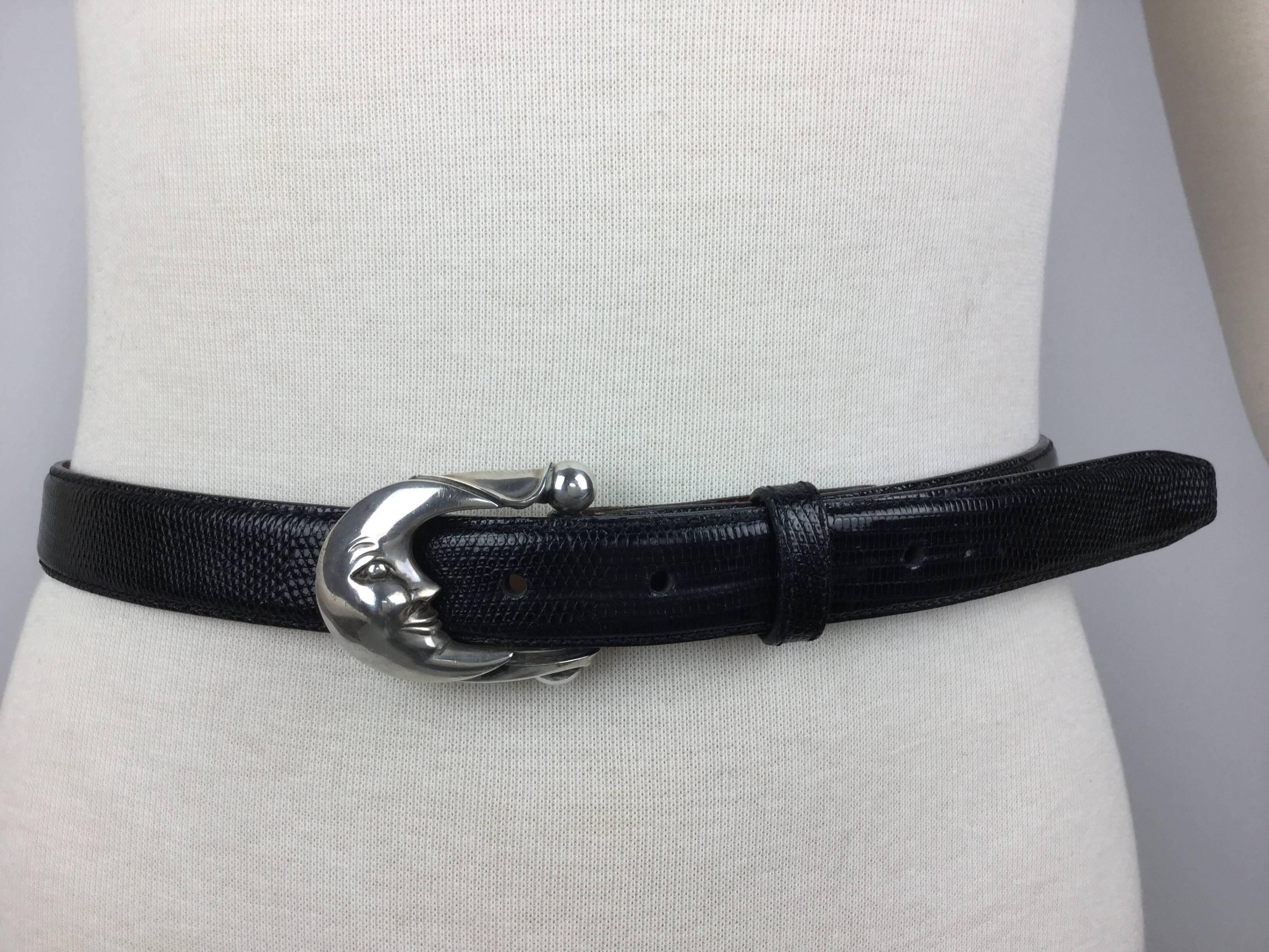 
This is such an elegant and satisfying piece.

Just an absolute classic to wear and treasure.

Iconic Kieselstein Cord Sterling silver moon buckle mounted on a sleek
black lizard belt.  

Excellent Condition.

Signed:  

Buckle: B.