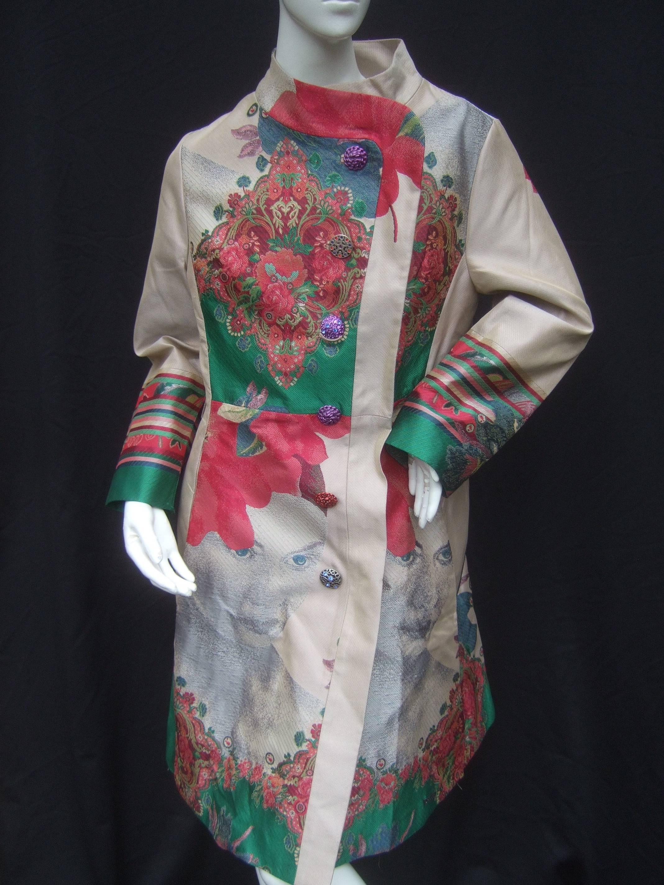 Exotic tapestry floral print spring coat
The Asian inspired light weight coat is illustrated
with bold floral graphics scattered throughout 
the front and back

The bohemian style buttons are a collection
of various styles with enamel and