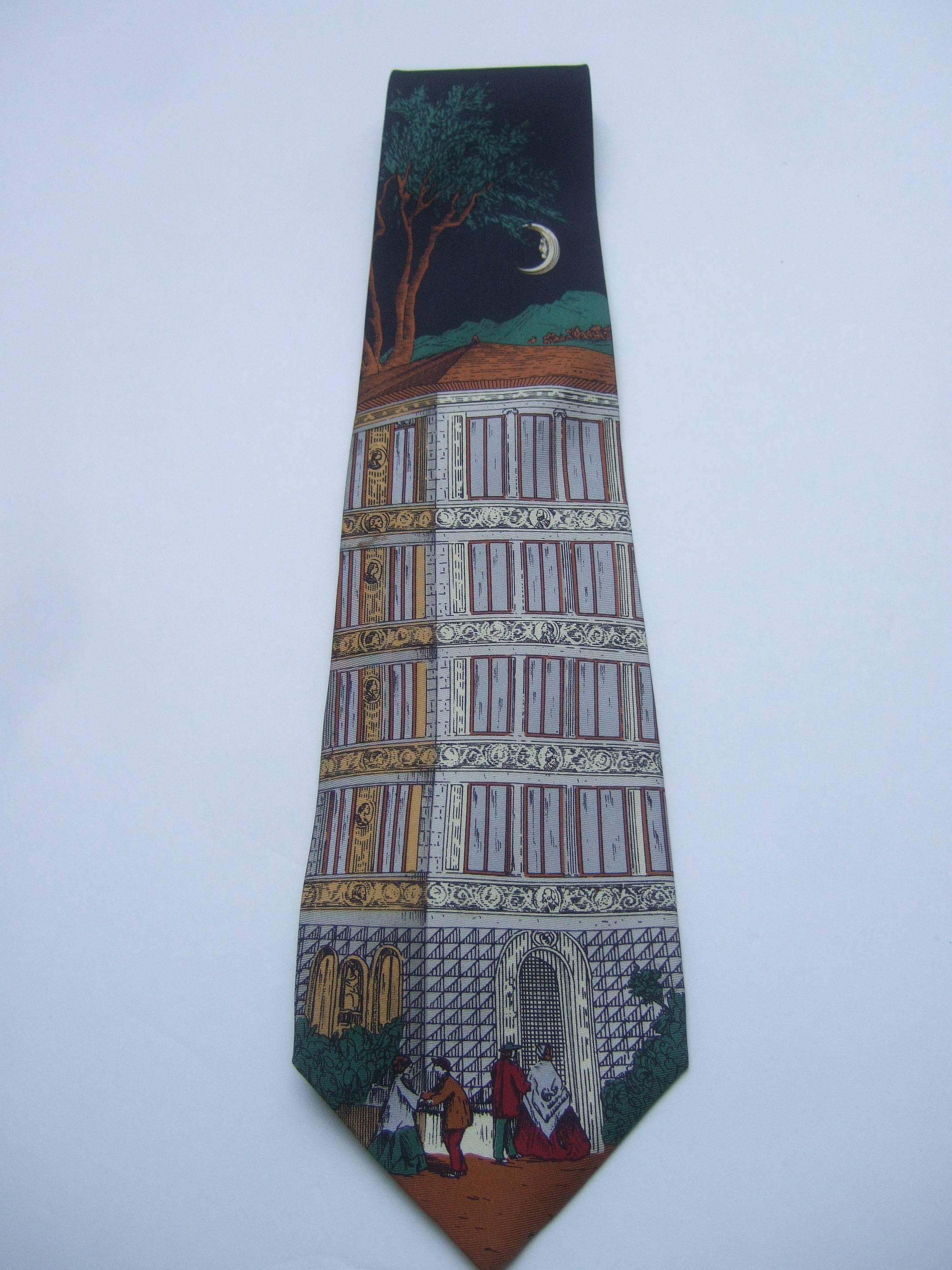 Fornasetti Italian graphic print silk necktie 
The designer necktie is illustrated with two
pairs of courting couples in front of a building
facade 

A crescent moon is glowing above the 
building with lush foliage in the background 
The silk