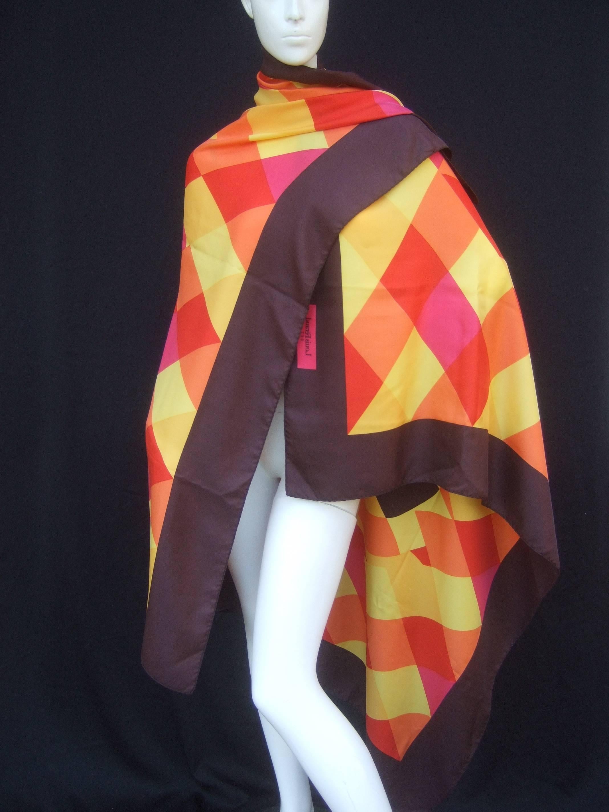Louis Feraud Massive silk print shawl / scarf 
The large scale shawl / scarf is a collage 
of bold triangular graphics in bright primary
colors

The center is contrasted with circles and curved
designs. The wide border that frames the