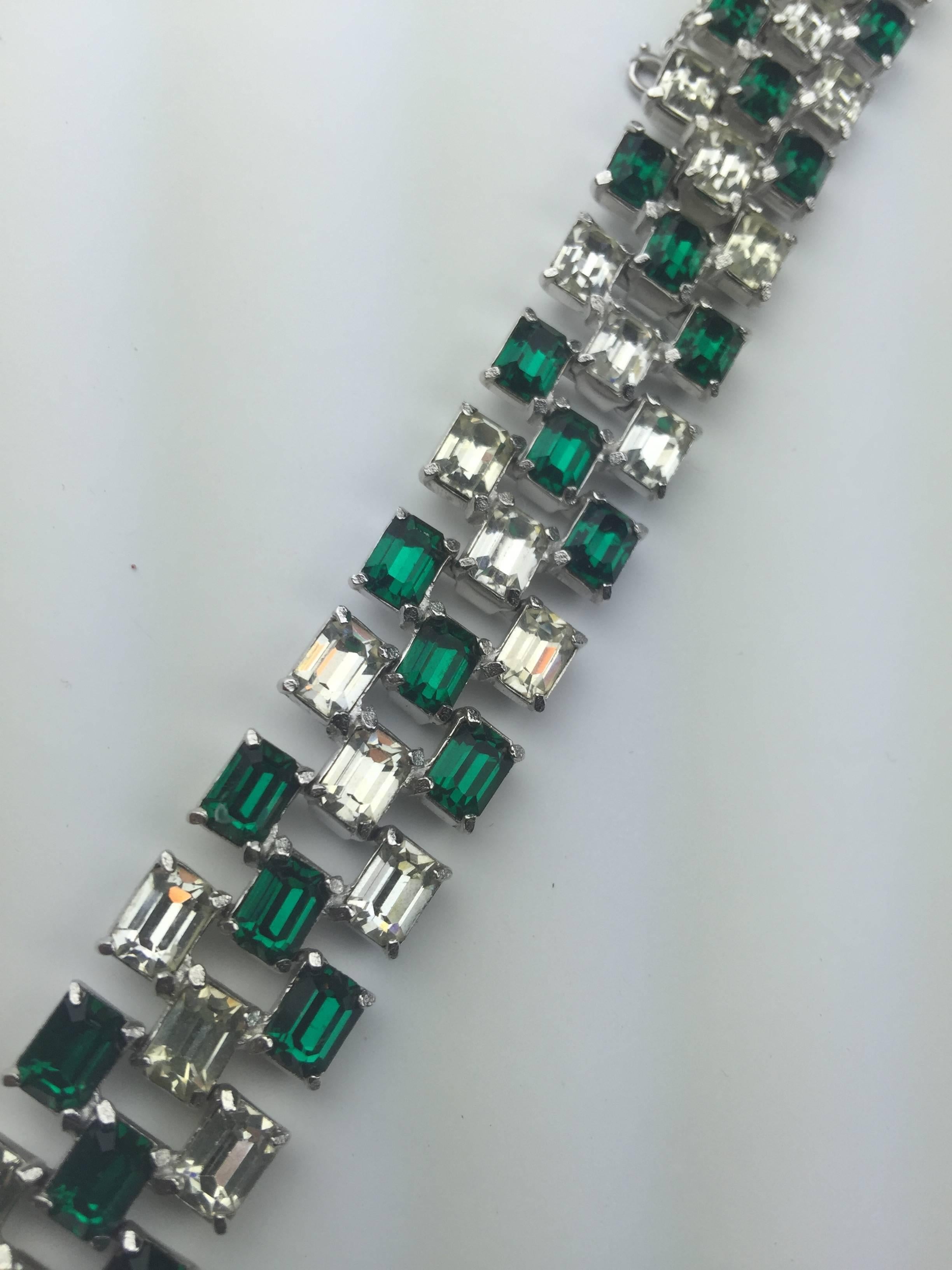 Wonderful early 1940's chunky Art Deco style bracelet with rectangular, highly faceted, faux emeralds and diamonds.  Rare and early Eisenberg piece which uses the finest quality Swarovski Austrian crystals.

Designed by Ruth M. Kamke.

Every