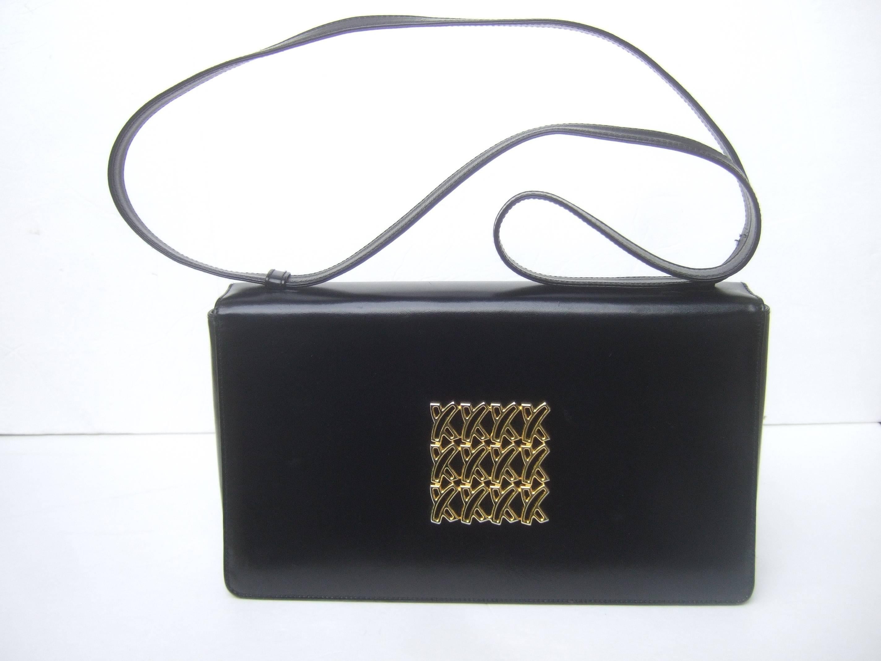 Paloma Picasso Italian black leather shoulder bag 
The stylish black leather handbag is adorned 
with Picasso's signature gilt metal  X symbols

The versatile leather handle strap transitions
from a handbag with double handle