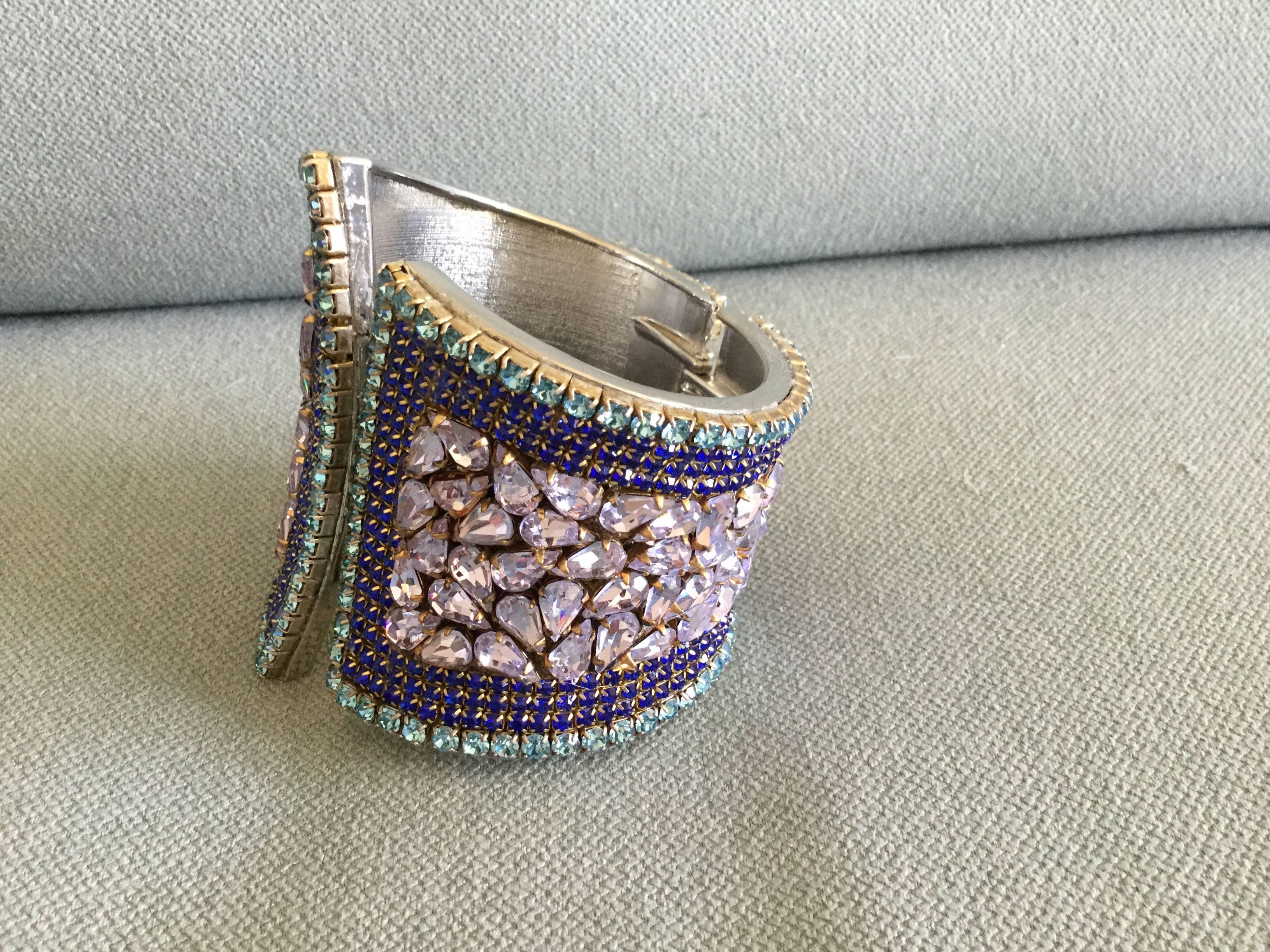 Show stopping clamper style cuff bracelet.  Interesting asymmetrical design. Highly original color palette of gorgeous aquamarine, sapphire, and pale lavender crystal pastes set in silver toned metal.  All pastes are hand set. This piece really