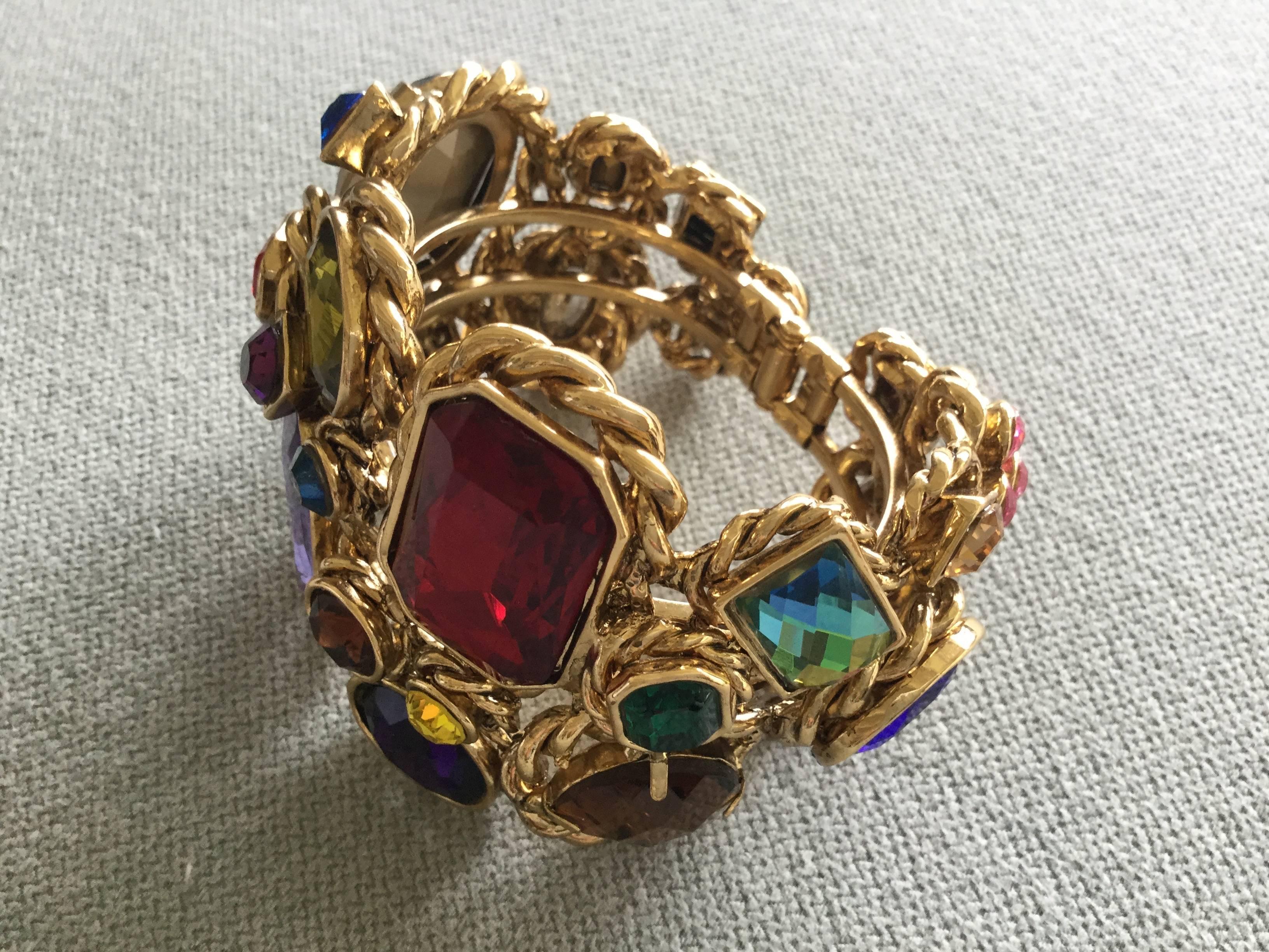 Spectacular original 1980's Butler and Wilson vintage cuff/clamper bracelet.  Monumental in scale, superb in quality. Simply not of the same universe as today's Butler and Wilson pieces.  Variously sized faceted crystal pastes in richly colored