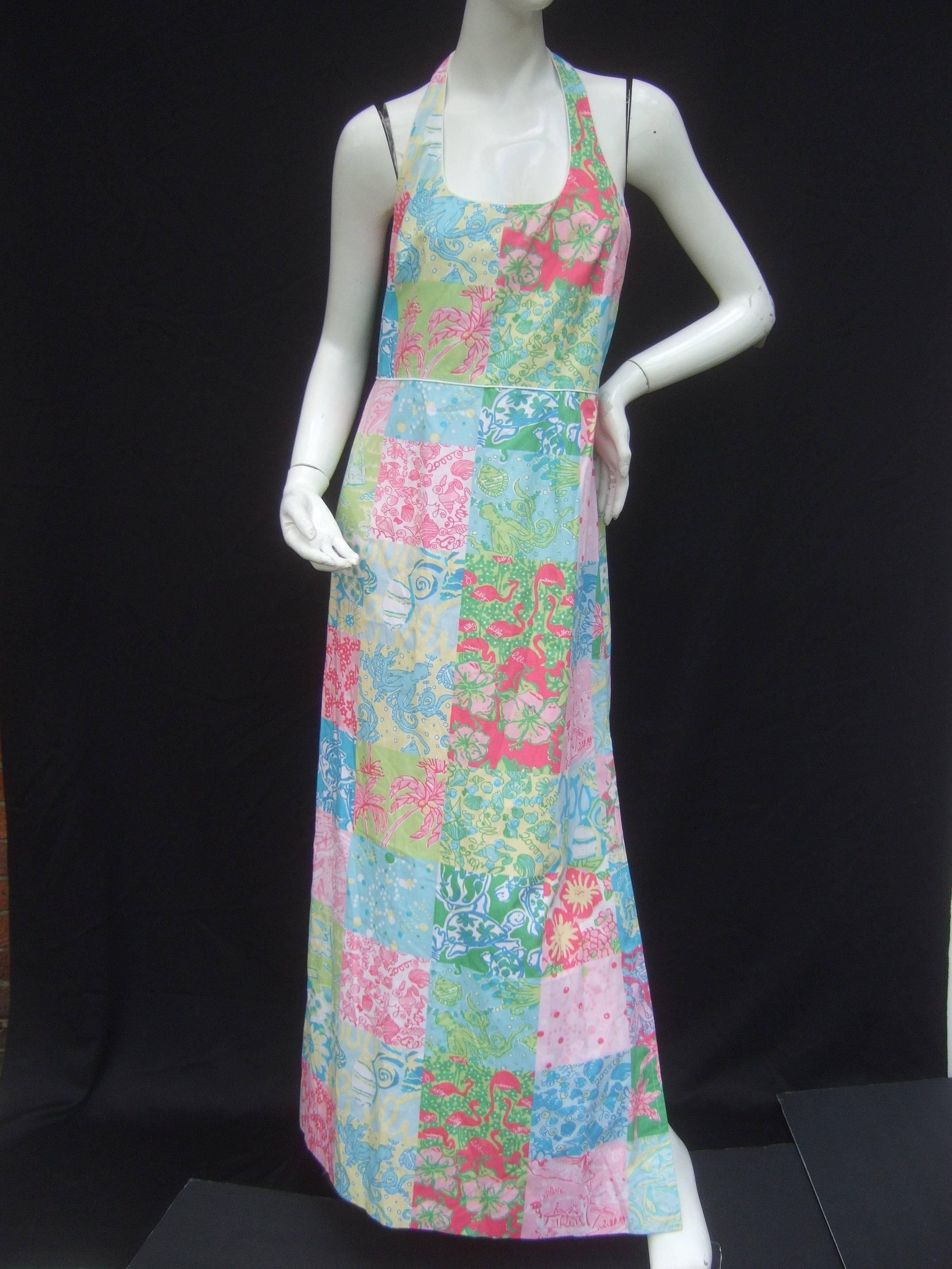 Lilly Pulitzer vibrant sea life cotton print gown
The crisp cotton halter gown is deigned with 
a series of bold sea life and floral graphics
in a square patch work style design

The collection of sea creatures, sea shells
and flowers have