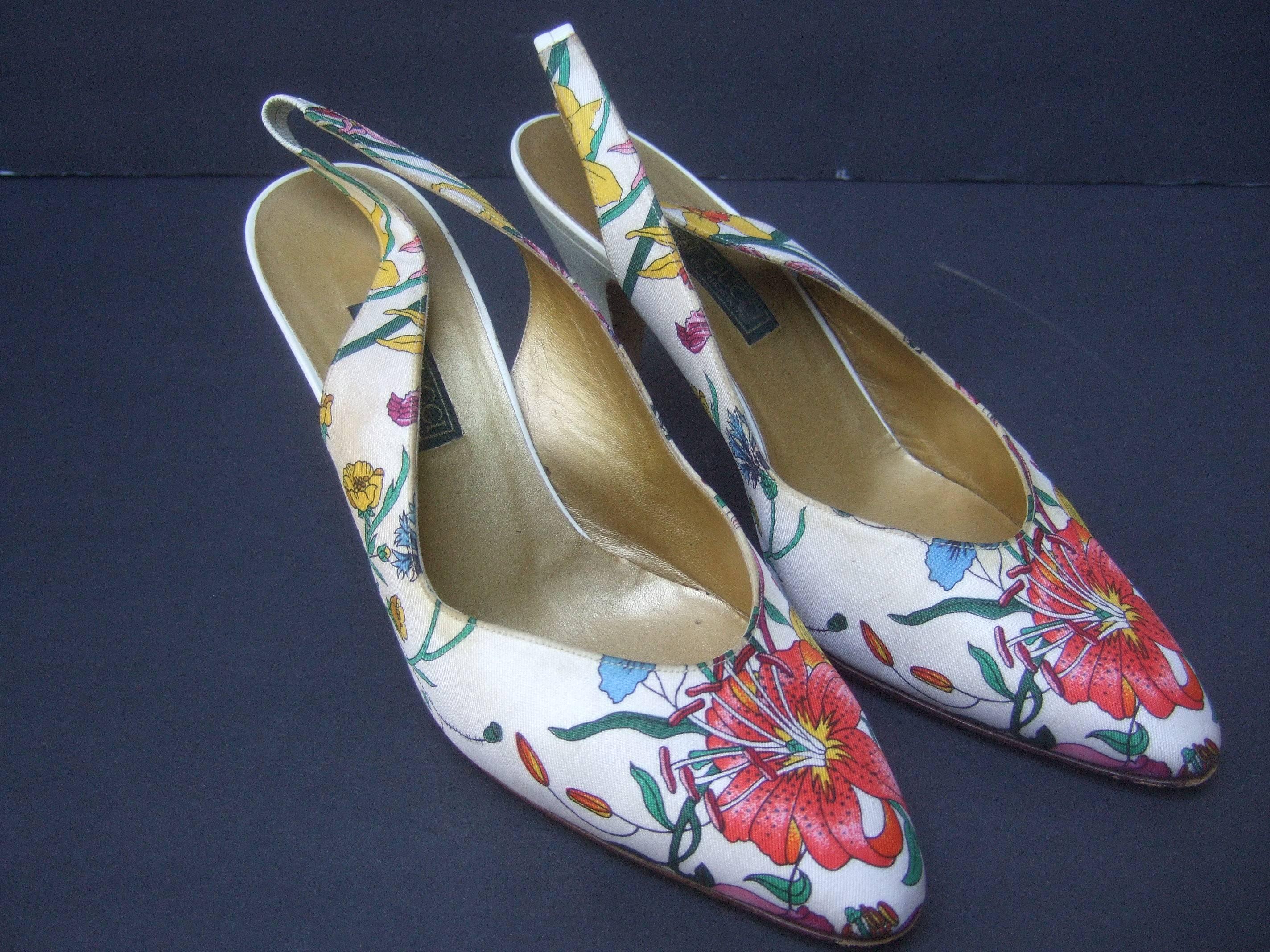 GUCCI Rare silk floral print slingback pumps Size 40
The chic Italian heels are designed with vibrant 
flower blooms throughout 

The heels are covered with crisp white leather
The Italian slingback pumps are designed
with an elastic tab on