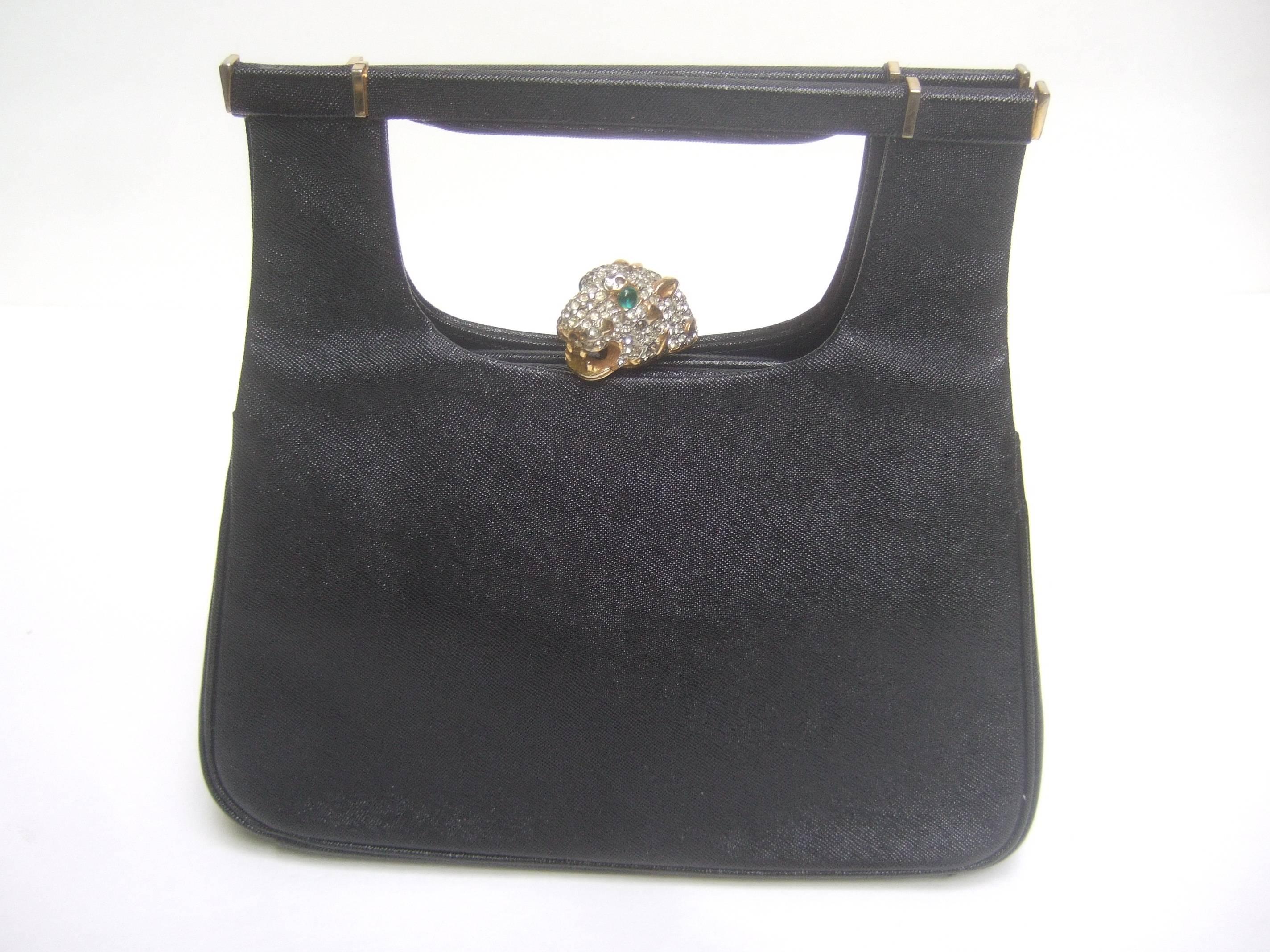 Exquisite Kenneth Lane jeweled jaguar clasp evening bag c 1970
The extremely rare evening bag was a collaboration with Kenneth Lane;
that were designed exclusively for Harry Rosenfeld's collection of extraordinary evening bags  in the 1960s

The