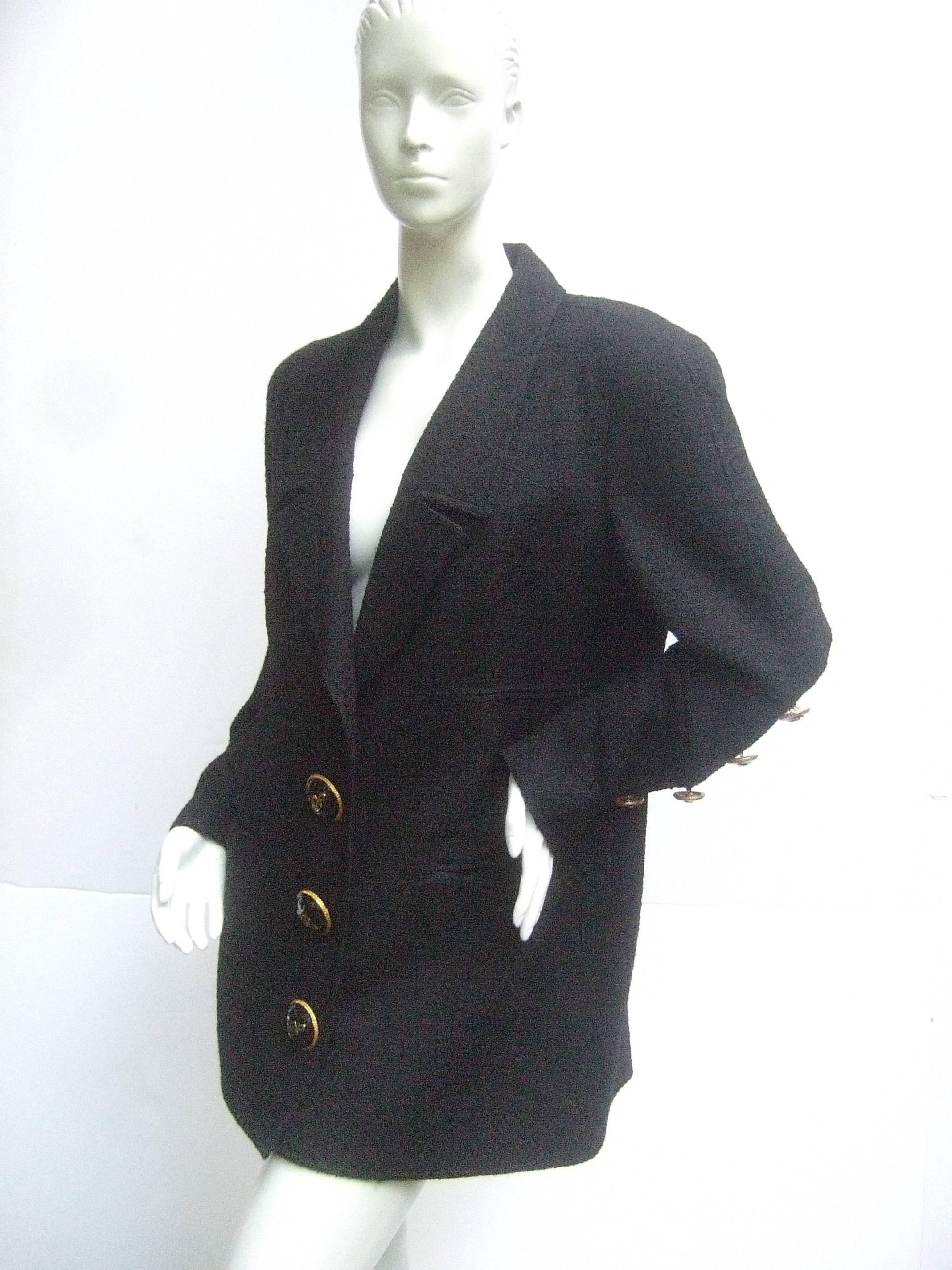 Liliane Romi Couture Paris black boucle wool jacket 
The stylish designer jacket is adorned with three
massive gilt metal buttons that run down the front
with L.R. script initials in gilt and black enamel 

The sleeves also have five matching