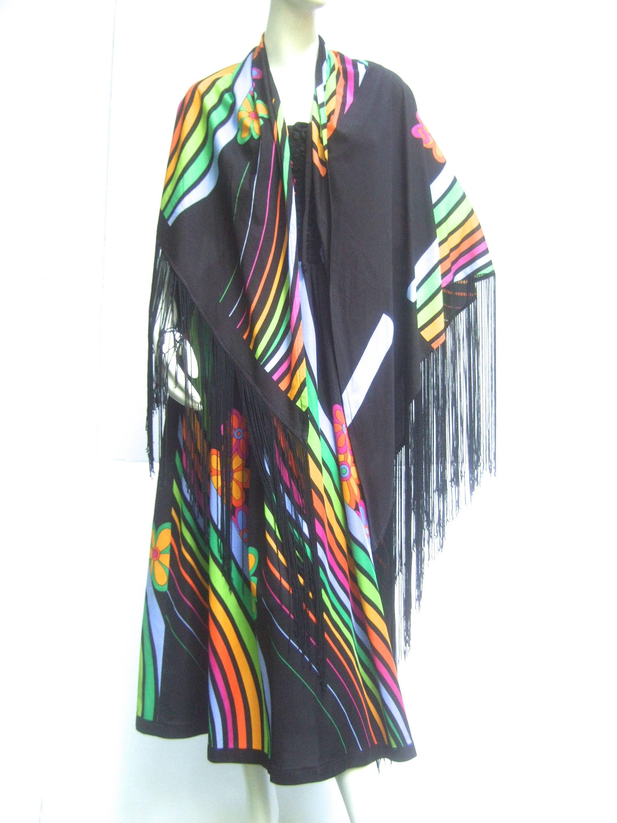 1970's polyester laced bodice dress and matching fringed shawl with amazing graphics. Rainbows of color, floral touches, and artfully plainer areas make for a truly unusual piece. Can be worn so many ways. A fab sundress on it's own, dressed up with