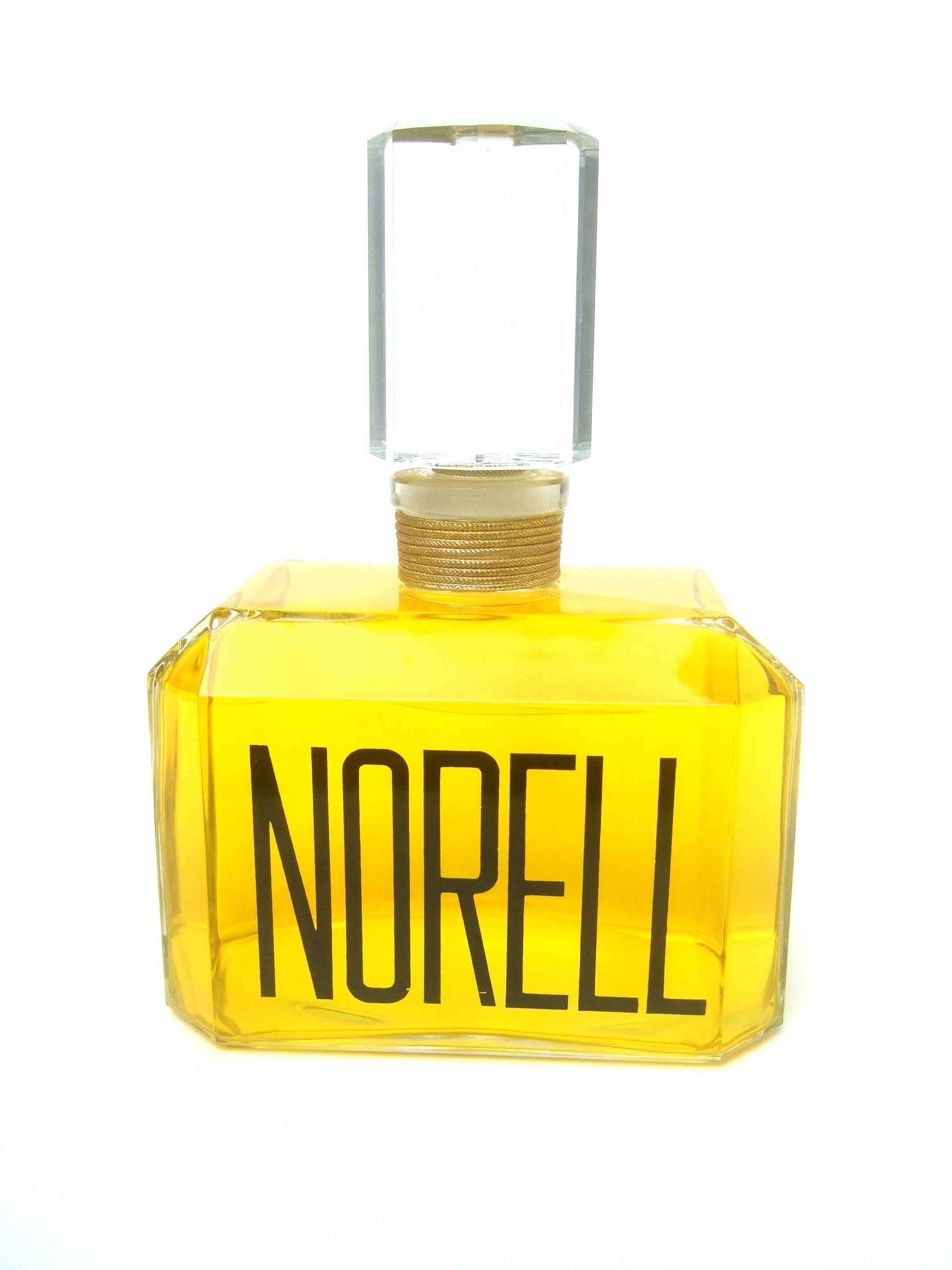 Norell Sleek large scale crystal factice display bottle 
The elegant crystal fragrance bottle was a display 
from a department store fragrance counter

The large scale replica bottle is designed with 
a cut glass crystal stopper. The