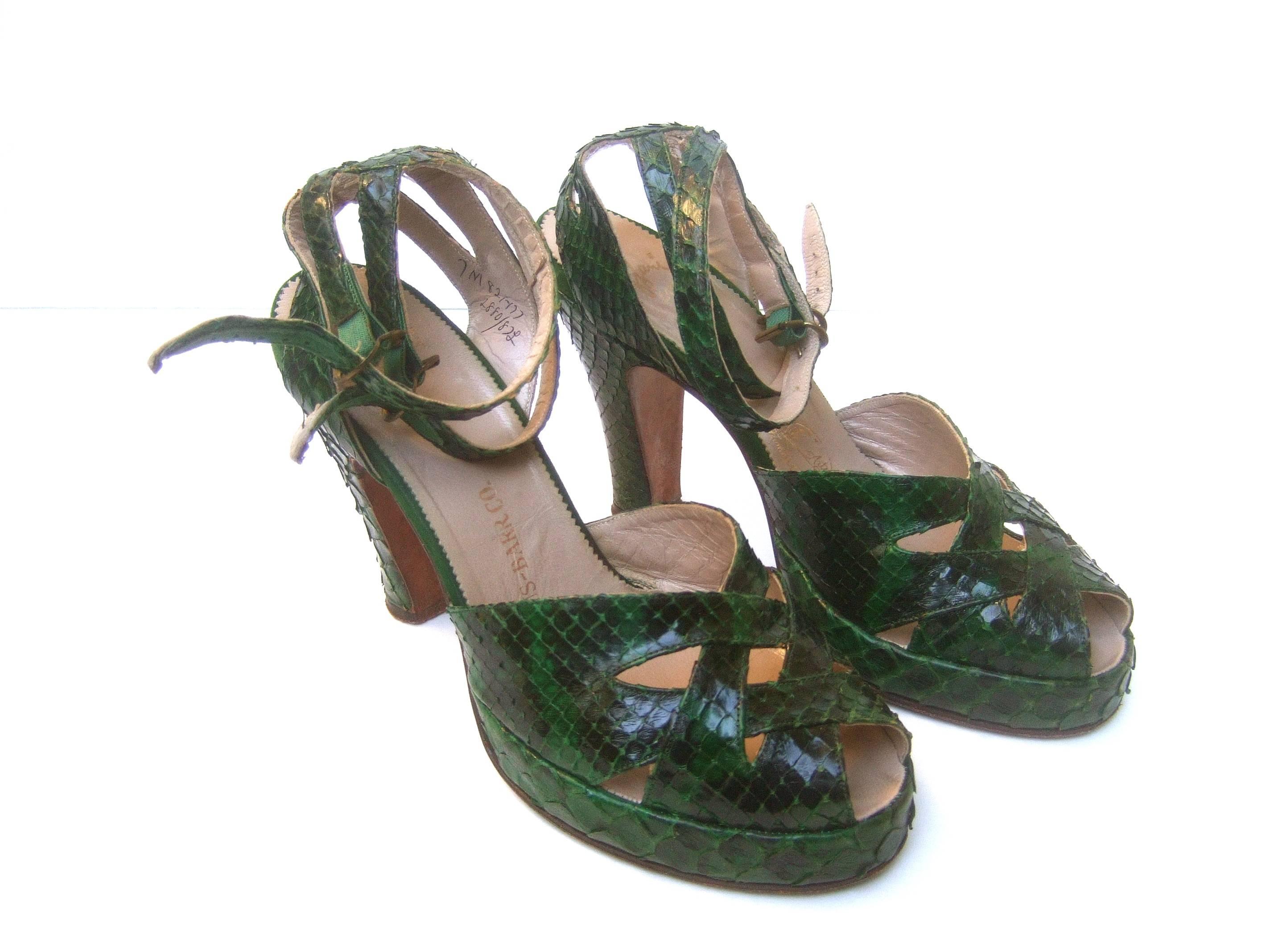 1940s Exotic snakeskin peep toe ankle strap platform shoes 
The stylish retro ankle strap platforms are designed
with dark green snakeskin 

The ankle straps have two bands of snakeskin 
that wrap around the leg. The front of the shoes
have a