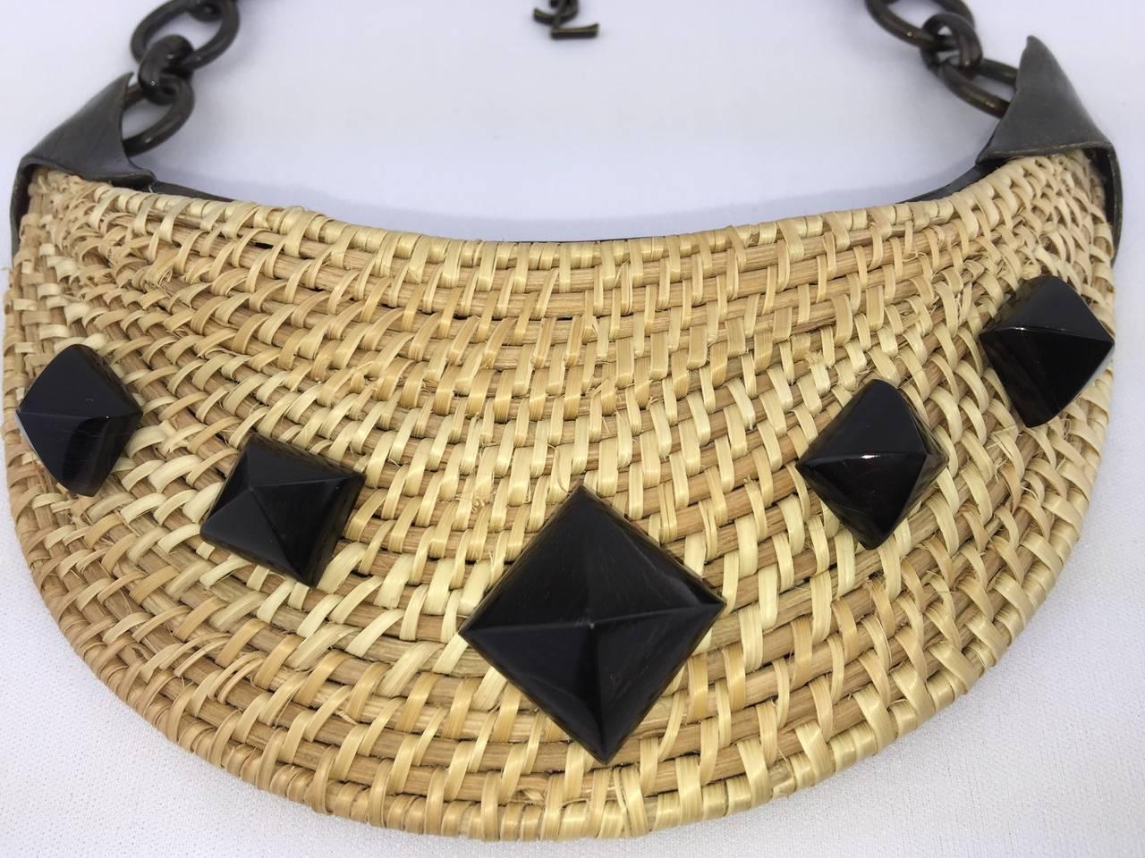 A bold and truly splendid Saint Laurent necklace.   Such an interesting combination of tribal bronze age monumentality with proper on-trend wicker.   Dates from the early part of the 21st century.   Comprised of a large central wicker crescent