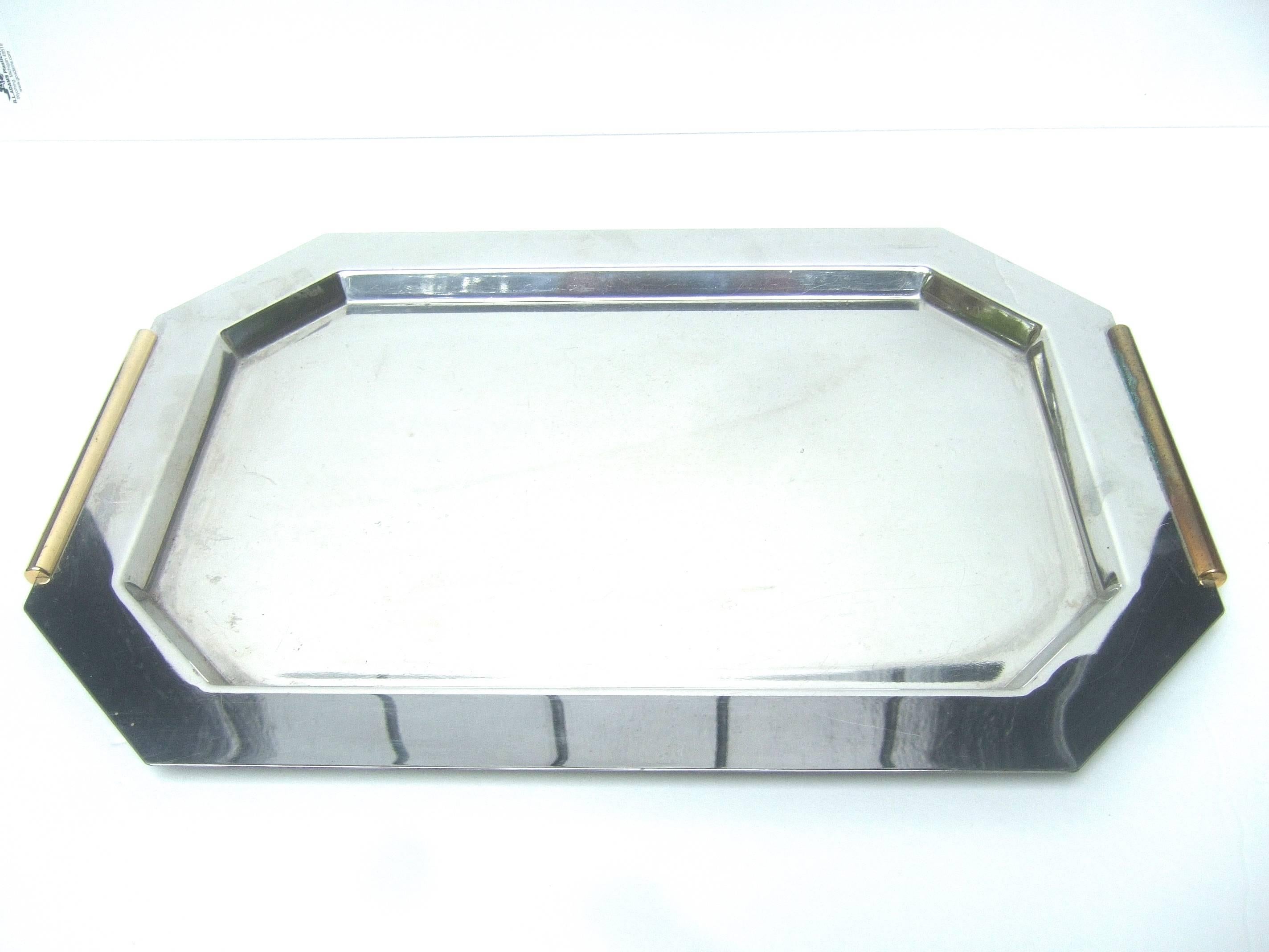 ****RESERVED SALE PENDING FOR JOHN***

Van Cleef & Arpels Paris sleek chrome vanity tray c 1990
The art deco inspired rectangular tray is accented
with gilt metal trim on the sides that serve as low
profile handles 

Makes an elegant