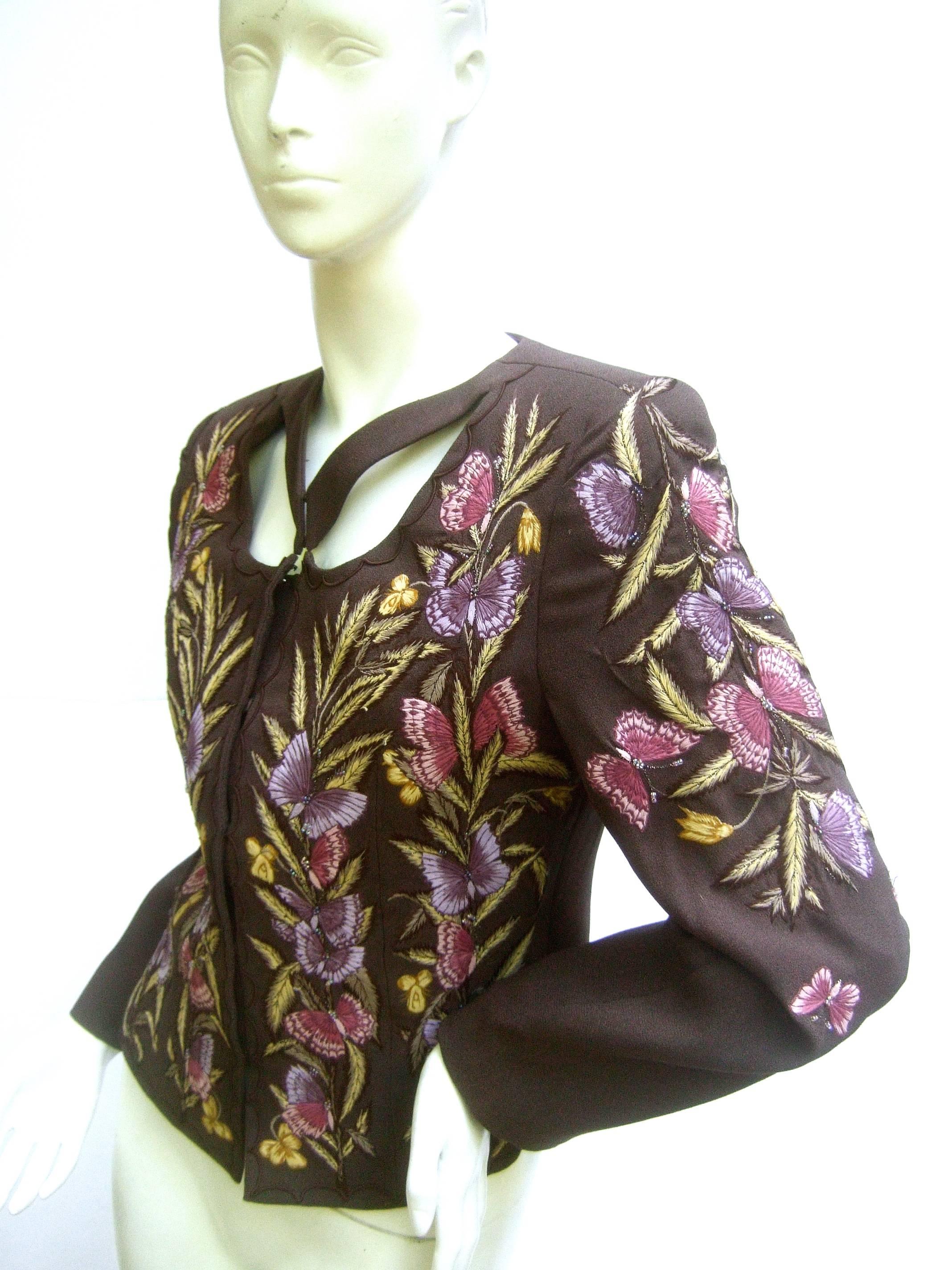 Embroidered butterfly brown wool jacket by Zelda c 1990s
The stylish jacket is embellished with a collection 
of pastel embroidered butterflies 

The series of embroidered butterflies and foliage 
run down the front and extend to the