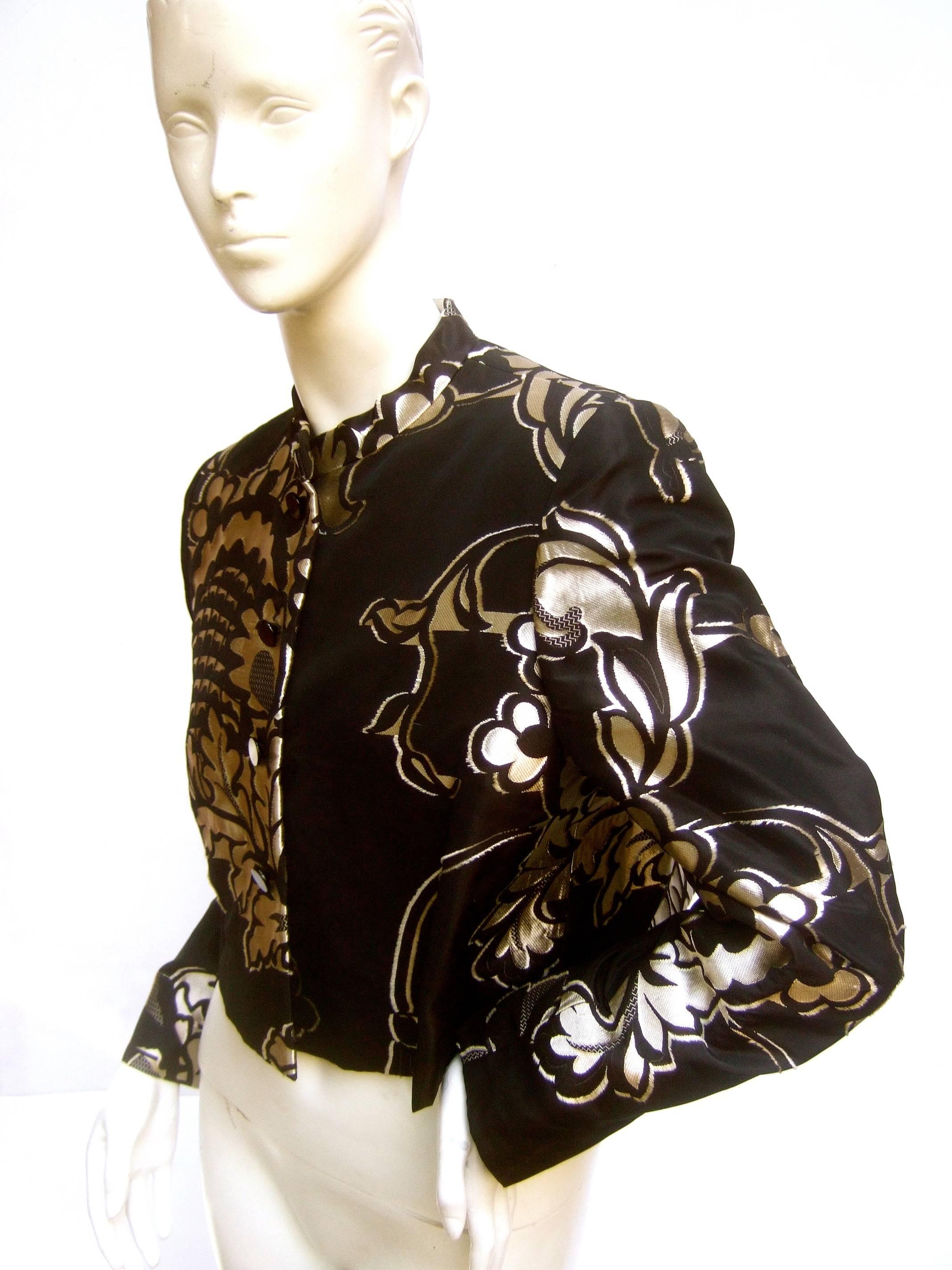 Bill Blass for Neiman Marcus black & gold brocade bolero
The chic designer designer cropped lame jacket 
is embellished with sinuous metallic foliage  

The gold metallic foliage is illuminated against
the solid black background. The fabric has
