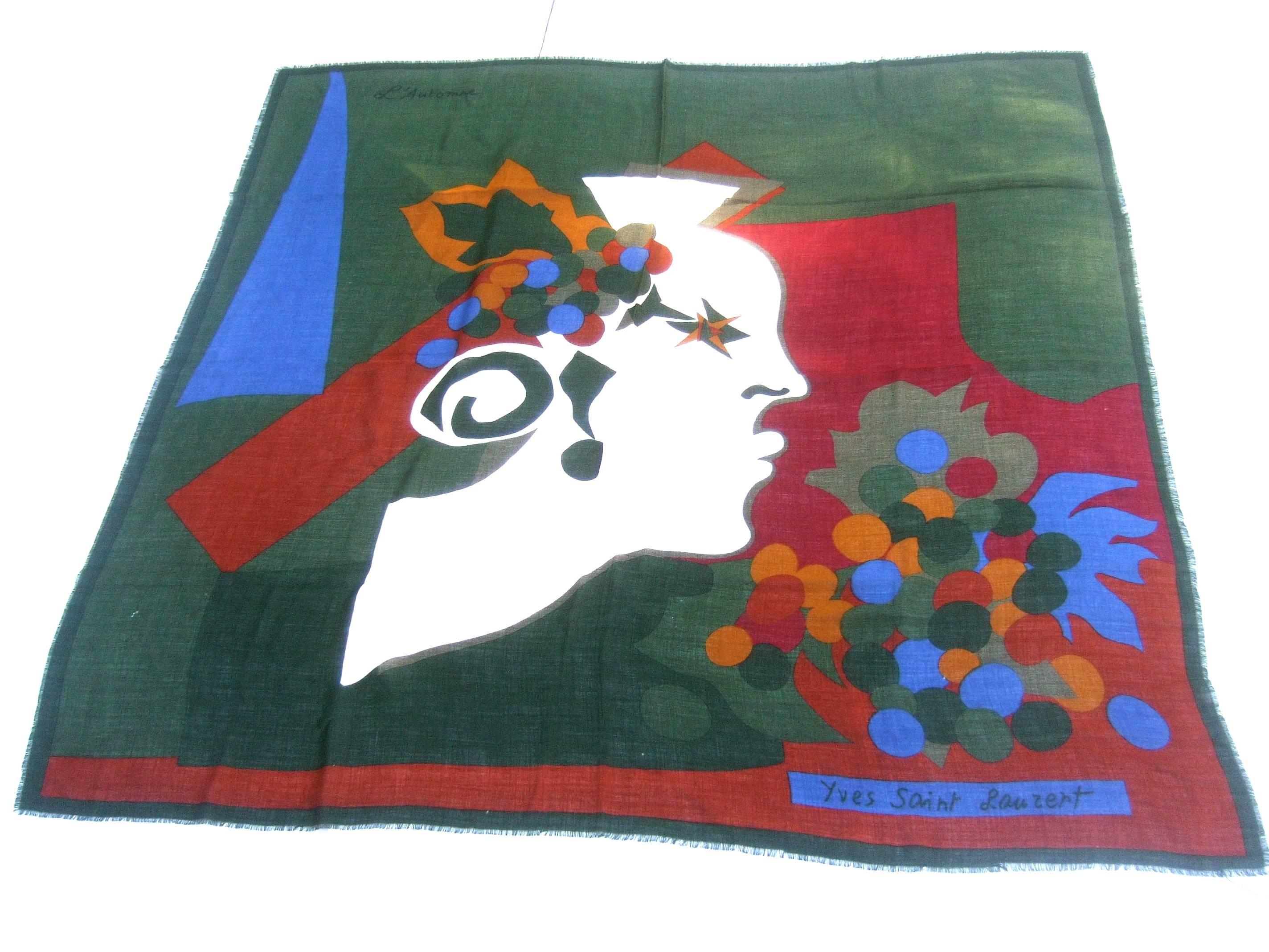 Yves Saint Laurent Stunning Italian wool shawl scarf c 1970s
The beautiful huge shawl- scarf is illustrated 
with a female figure surrounded by autumn 
color block designs 

The amazing sheer wool shawl - scarf is entitled 
L'Automne. The