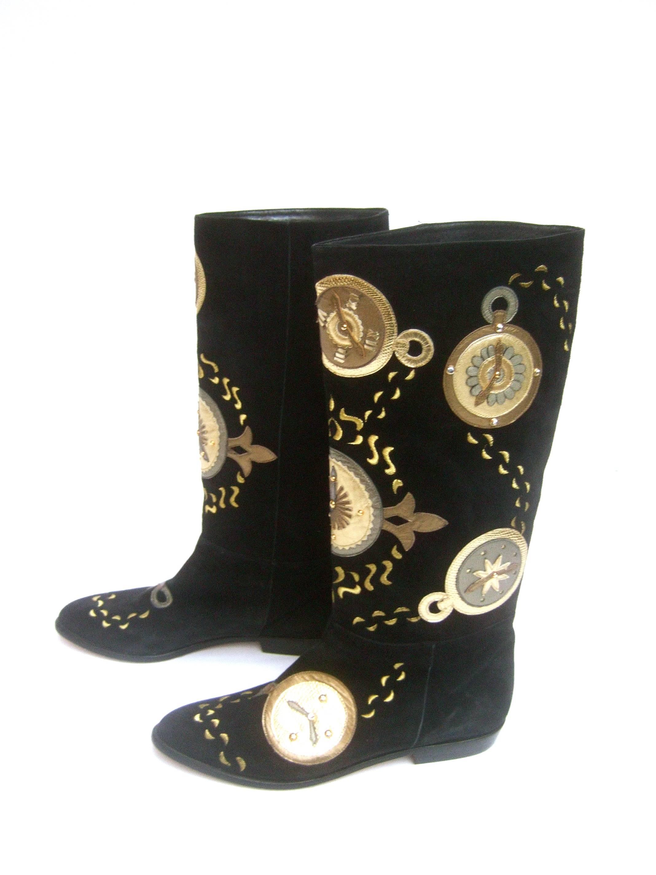 Black suede metallic clock theme boots by Zalo US Size 9 M
The unique plush black suede boots are designed
with a series of metallic applique clock dials 

The gold & bronze applique timepieces are
accented with sinuous gold embroidery   
that