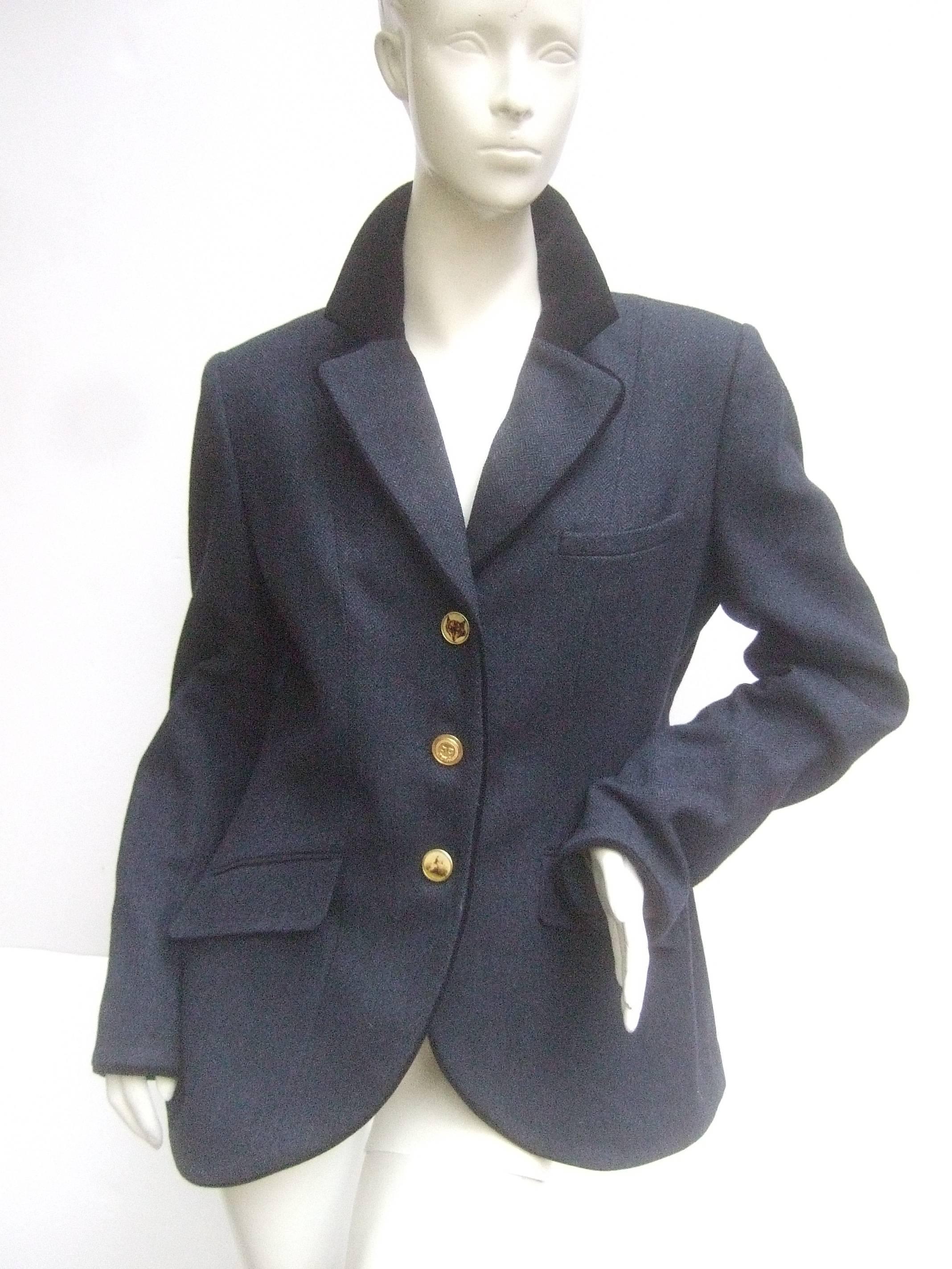 English style women's equestrian riding jacket 
The classic herringbone blue / gray wool jacket 
is designed with a black velvet collar & piping trim 

The unique trio set of buttons depict a fox, horse 
jumper & a gilt metal insignia