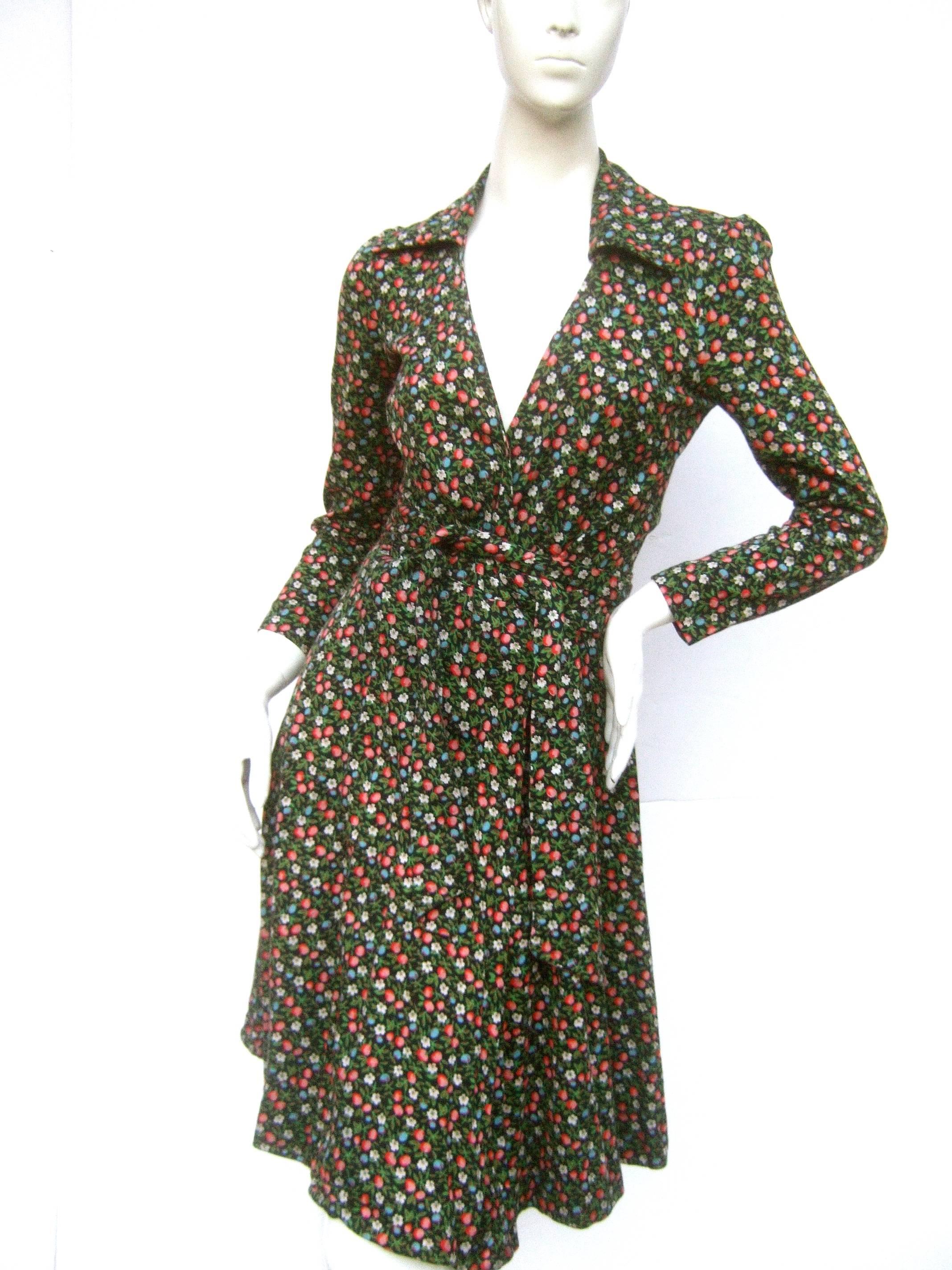 Diane von Furstenberg Iconic floral print Italian wrap dress c 1970s
The stylish wrap dress is illustrated with a field of delicate 
flower blooms; illuminated against a black background 

Von Furstenberg's clingy wrap dresses were the it