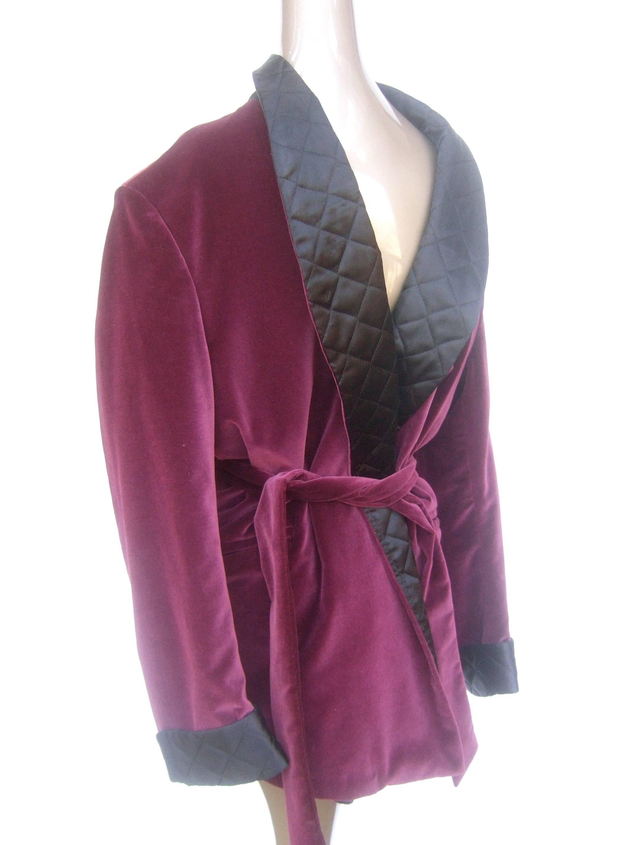Neiman Marcus Men's burgundy velvet smoking jacket 
The luxurious lounge jacket is designed with plush
burgundy color cotton velvet 

The collar lapel & cuffs are contrasted with quilted
black satin acetate. The stylish smoking jacket 
cinches