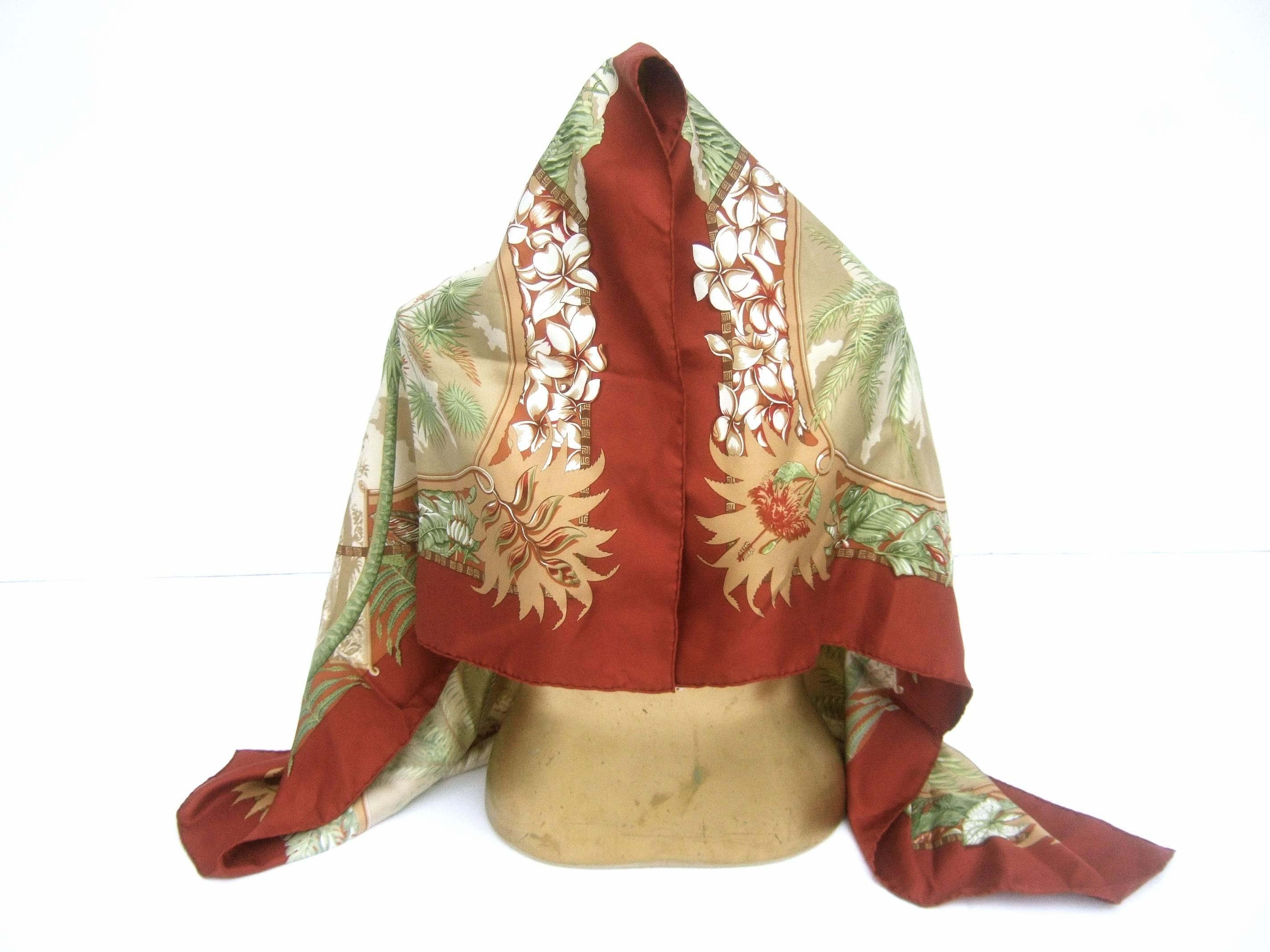 Hermes Luxurious Hawaiian theme silk scarf in Hermes box
The hand rolled silk scarf is illustrated with an exotic 
Polynesian woman in traditional Hawaiian attire

The dancing woman is surrounded by a mature tree
at the center surrounded by a flock