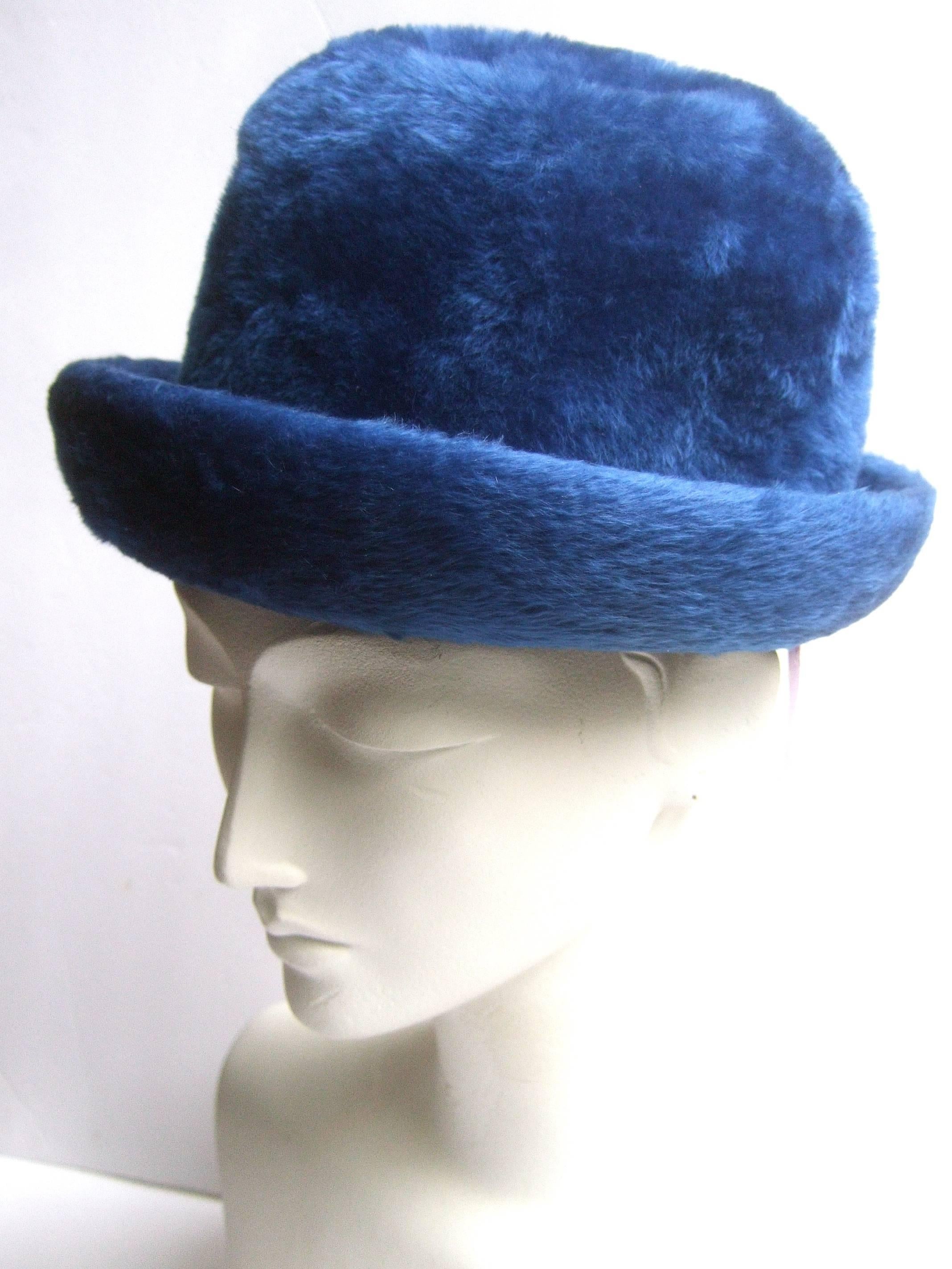Schiaparelli Paris fuzzy blue felt wool hat ca 1960
The stylish chapeau is paired with a gilt metal hat
pin accented with a dangling crystal orb 

Makes a striking accessory as well as 
a chic 20th century collectible

Labeled Schiaparelli Paris