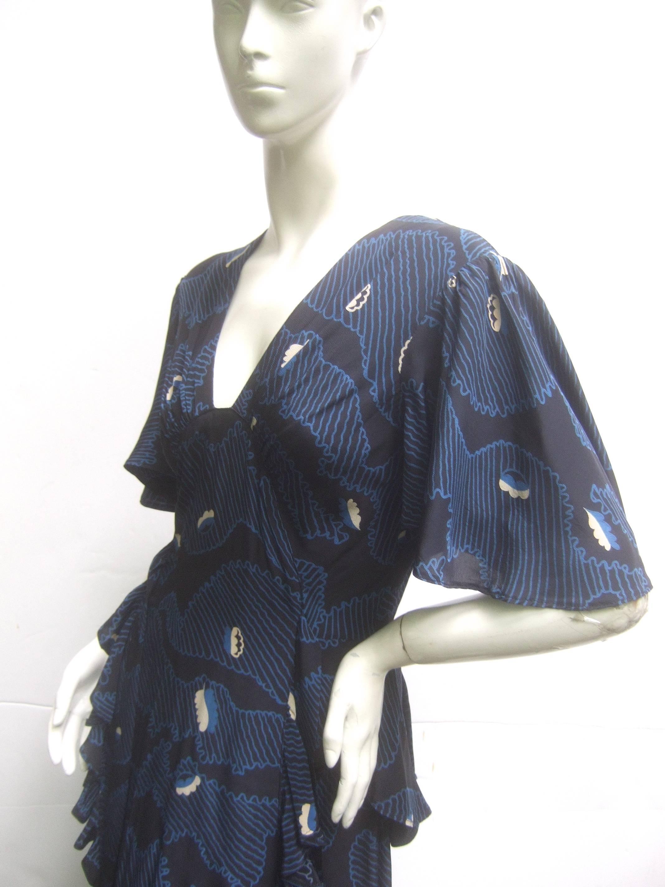 Simply splendid Ossie Clark peplum dress. Amazingly rare black, midnight blue, and white abstract print on moss crepe. Super flattering 1940's style. Gorgeous fluttering sleeves. Fabric designed by Celia Birtwell. Excellent Condition. Labelled Ossie