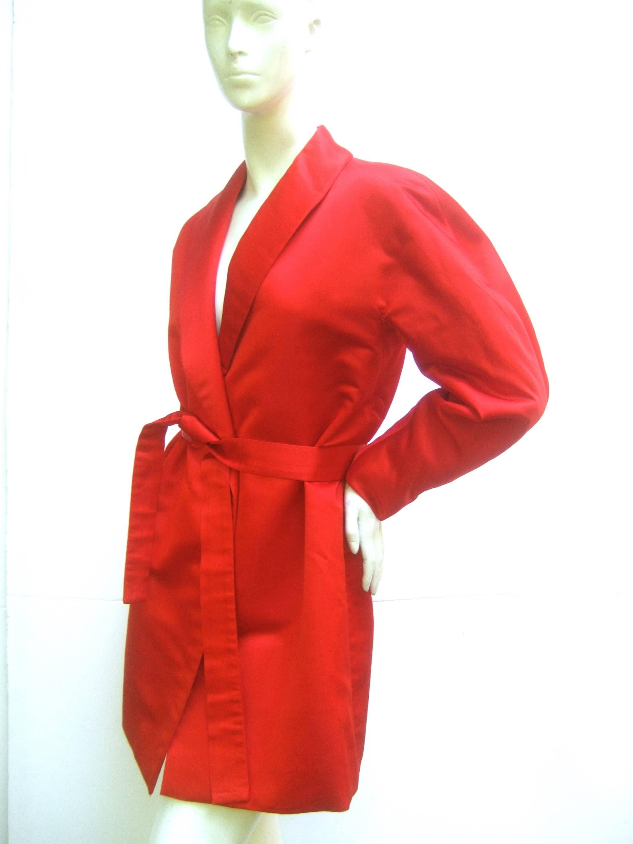 Incredible 1970's Halston couture wrap around belted jacket made of the finest satin and hand lined in silk. This is as sumptuous as vintage fashion comes! It just feels so wonderful to touch and wrap up in this. Totally channels the luxe Studio 54